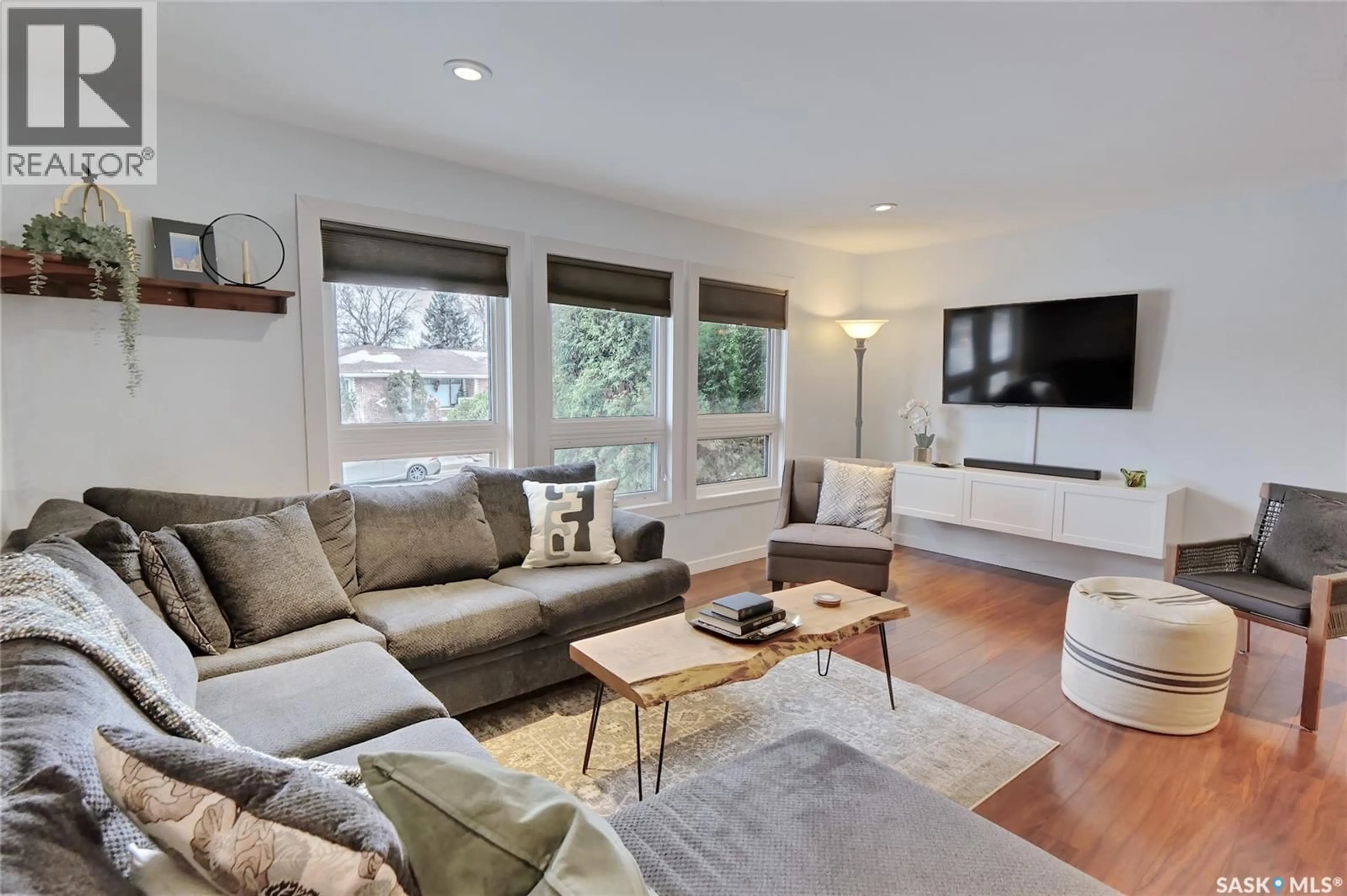 Living room with furniture, wood/laminate floor for 56 BLUEBELL CRESCENT, Moose Jaw Saskatchewan S6J1A2