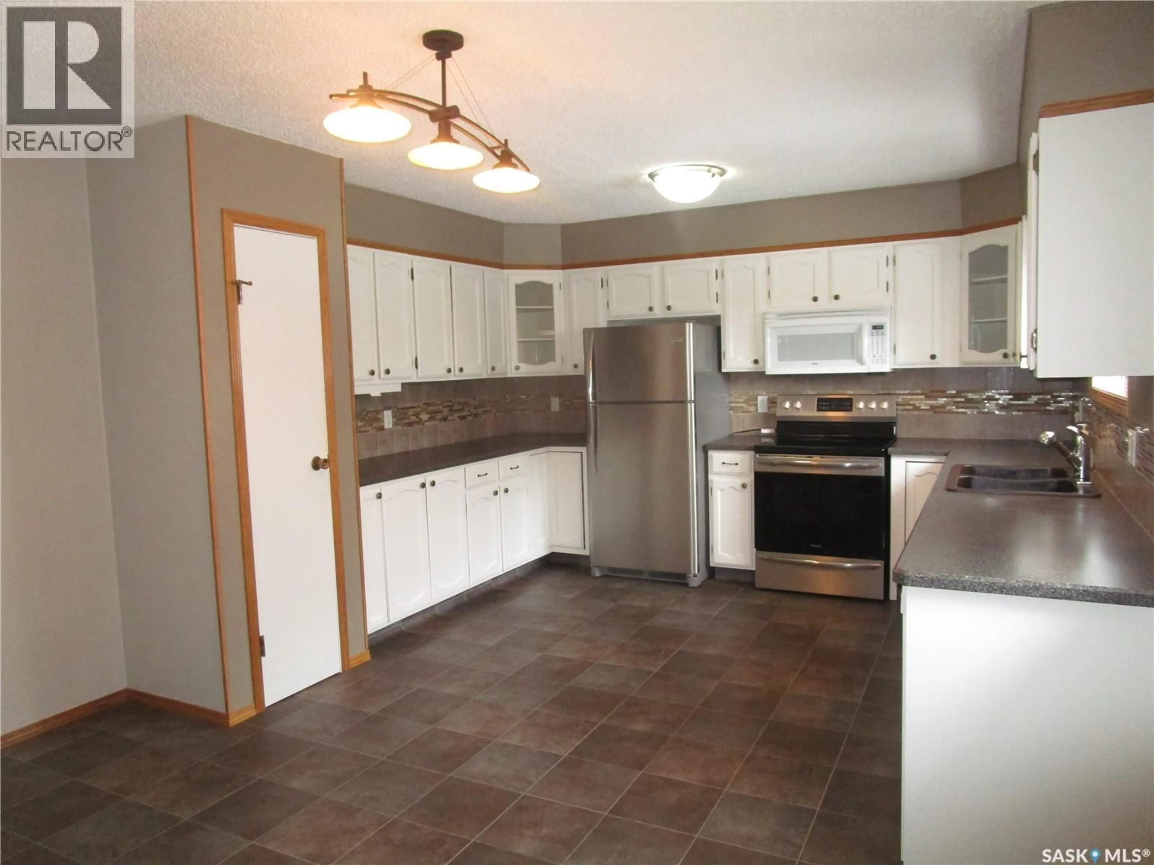 Standard kitchen, ceramic/tile floor for 1003 1ST STREET, Assiniboia Saskatchewan S0H0B0