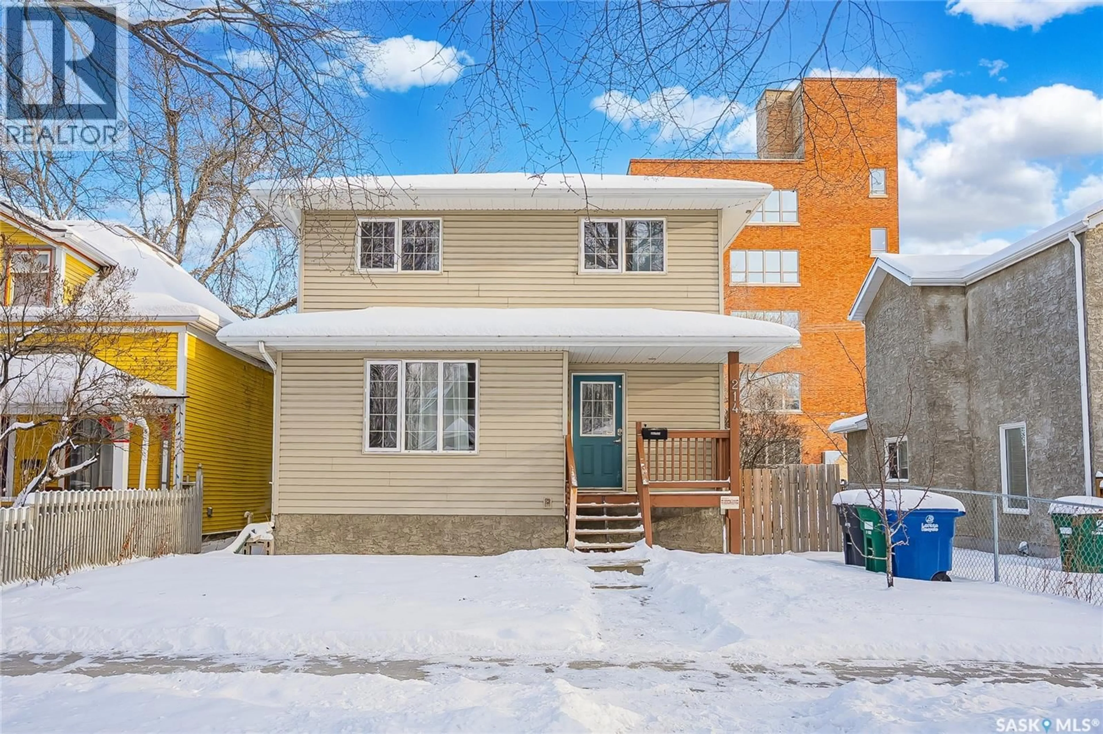 Home with brick exterior material, street for 214 E AVENUE N, Saskatoon Saskatchewan S7L1R7