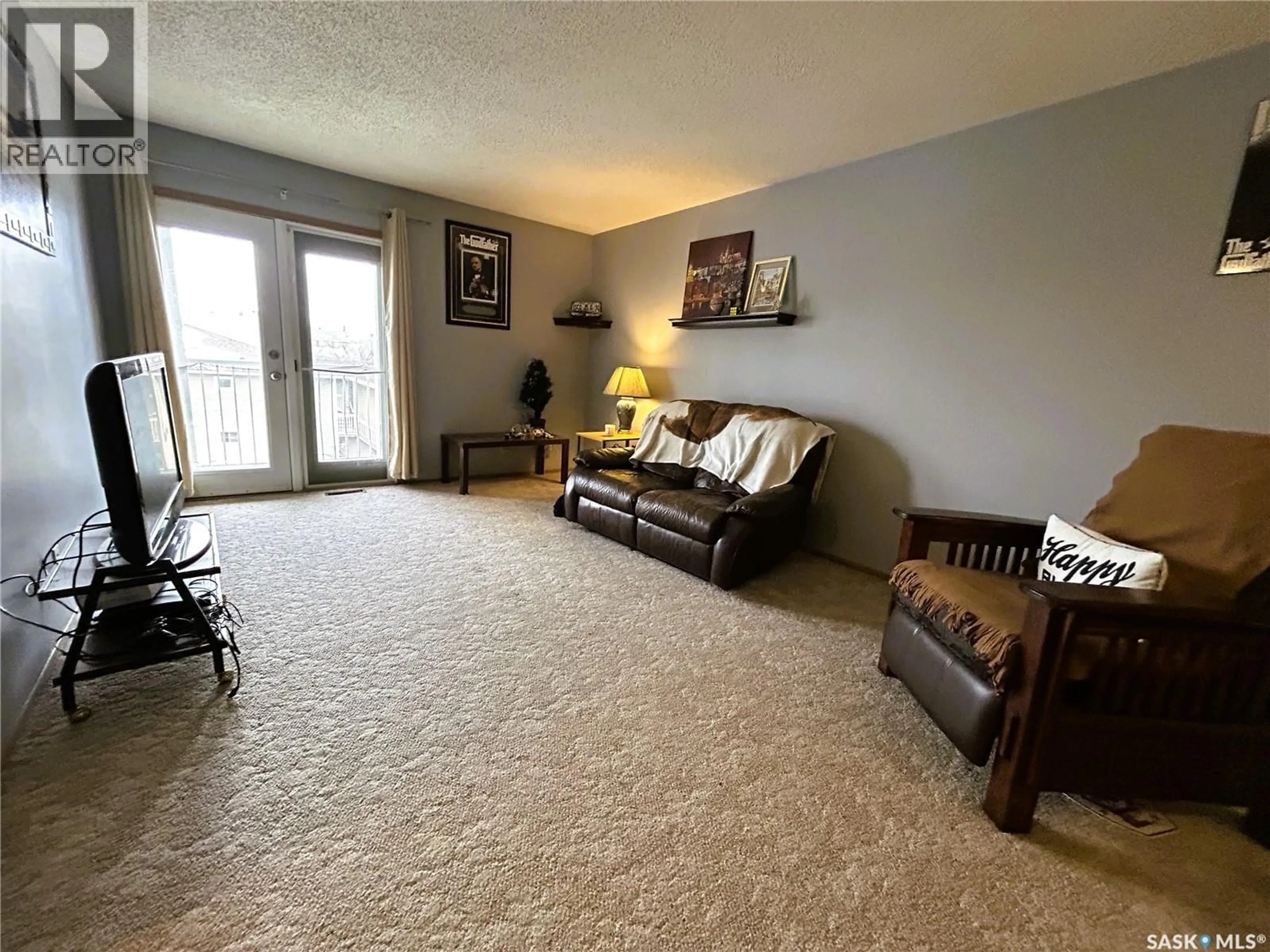 Living room with furniture, carpet floor for 6575 - 17 ROCHDALE BOULEVARD, Regina Saskatchewan S4X2Z1