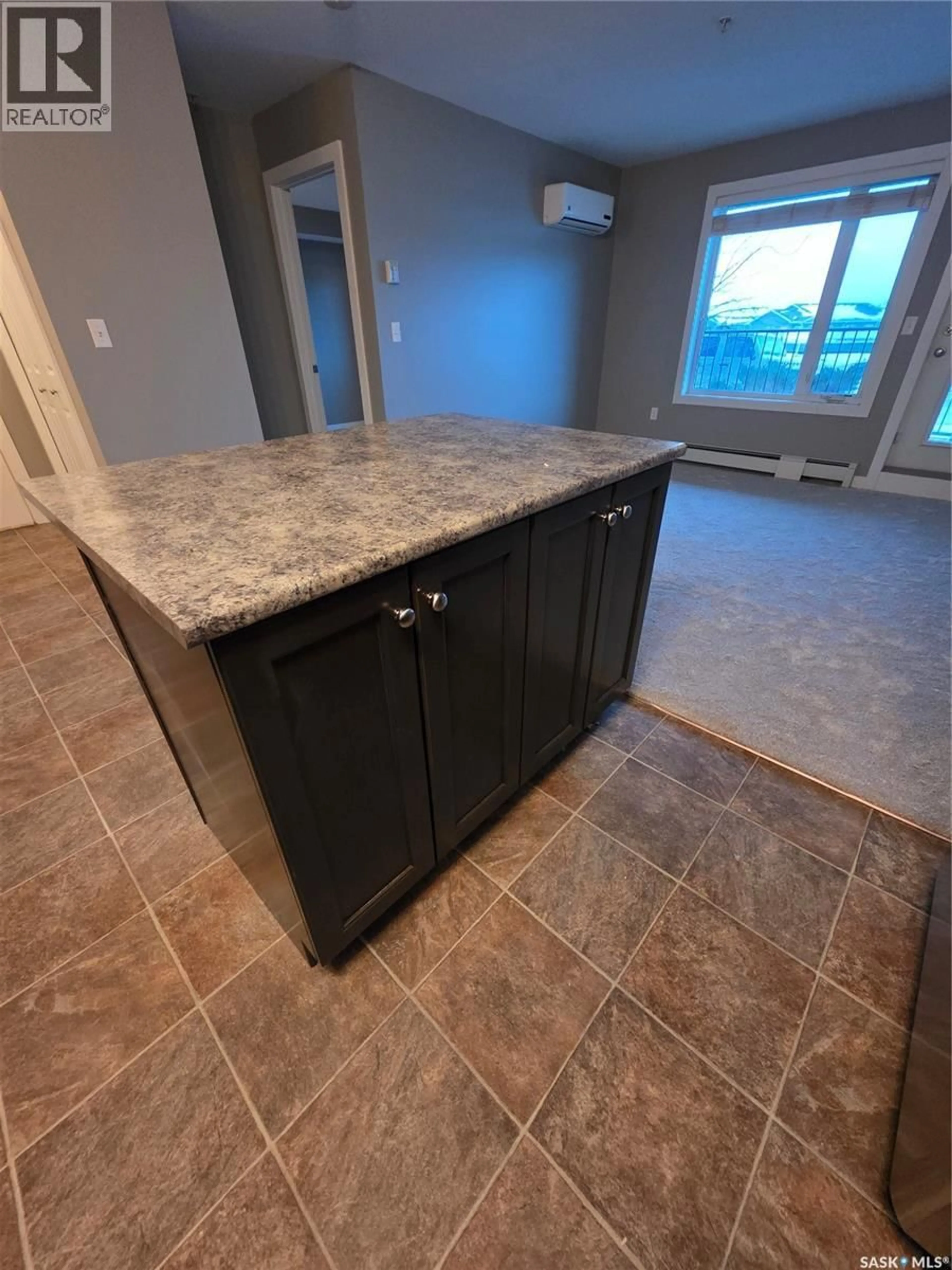 Open concept kitchen, ceramic/tile floor for 103 - 2141 LARTER ROAD, Estevan Saskatchewan S4A2Y5