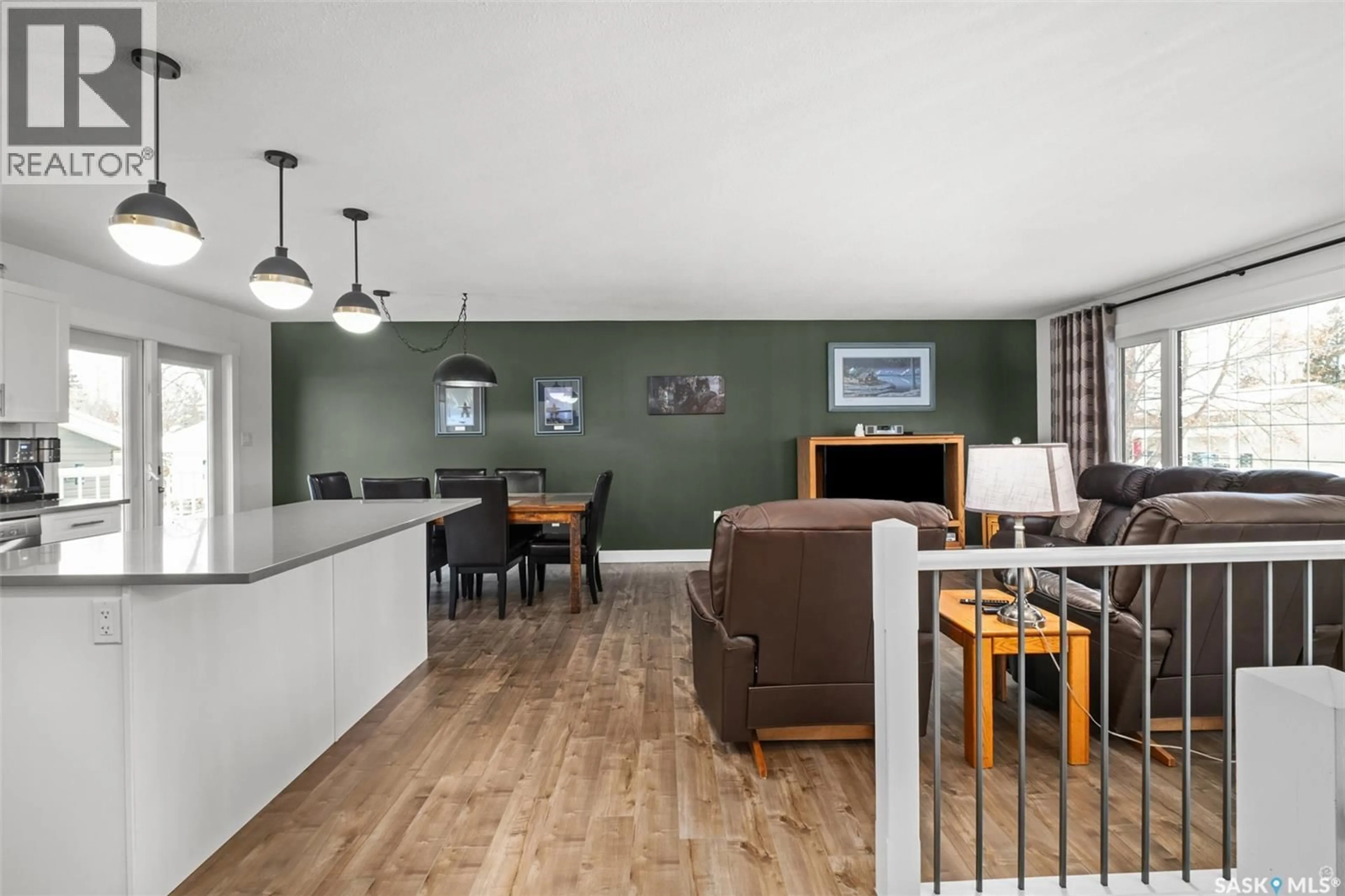 Living room with furniture, wood/laminate floor for 975 SANDERSON CRESCENT, Prince Albert Saskatchewan S6V6L2