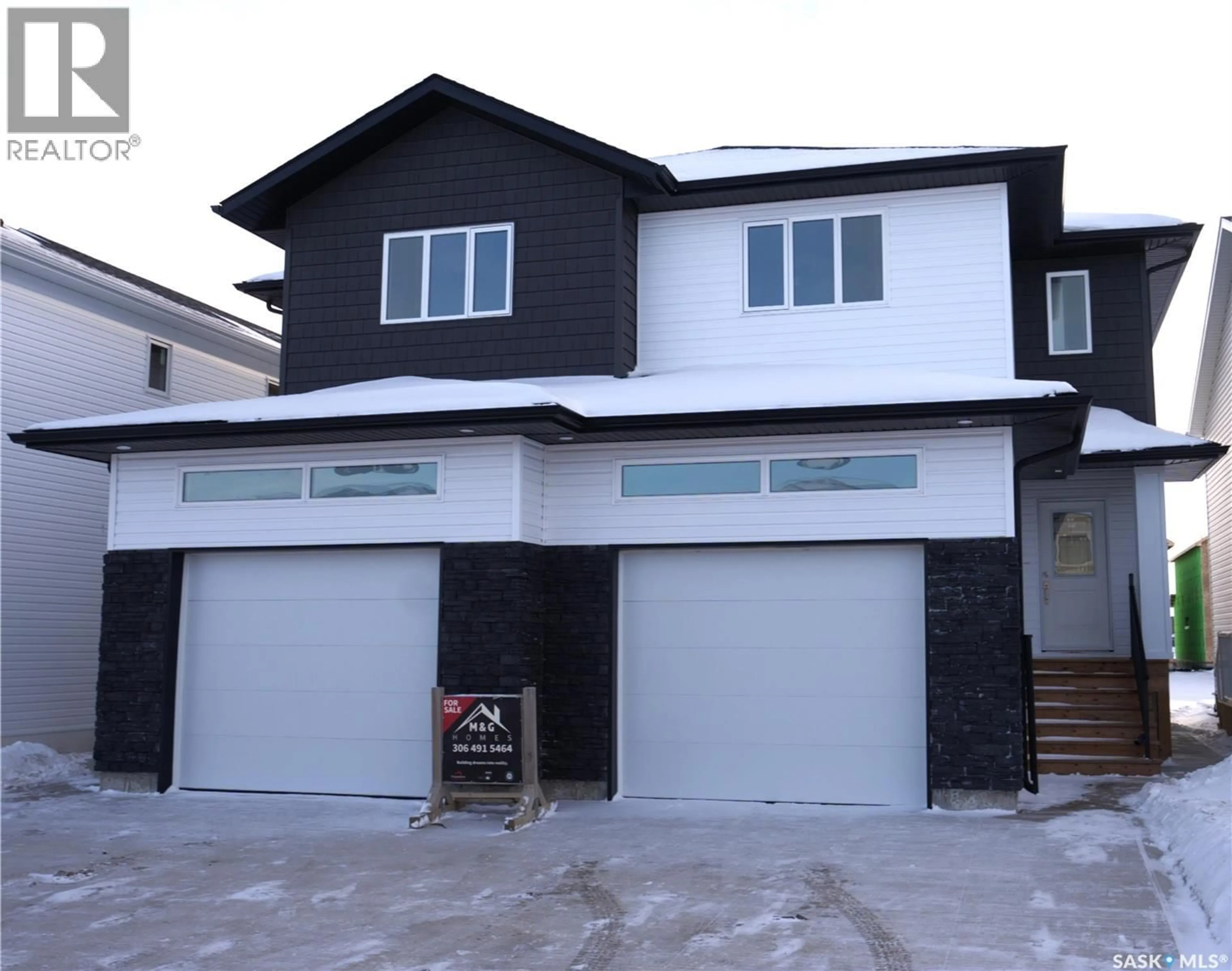 Home with vinyl exterior material, street for 521 SHARMA CRESCENT, Saskatoon Saskatchewan S7W0Z5
