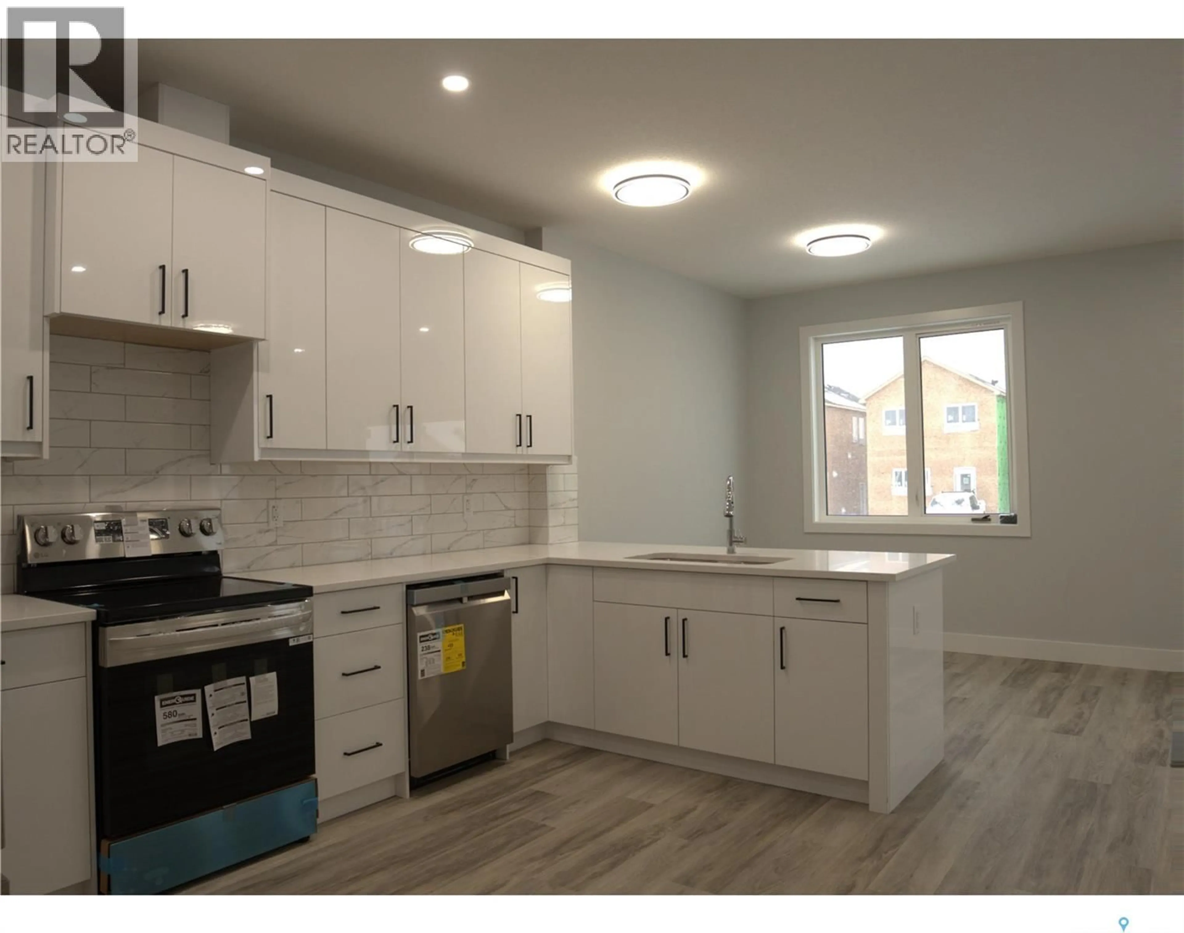 Open concept kitchen, unknown for 521 SHARMA CRESCENT, Saskatoon Saskatchewan S7W0Z5