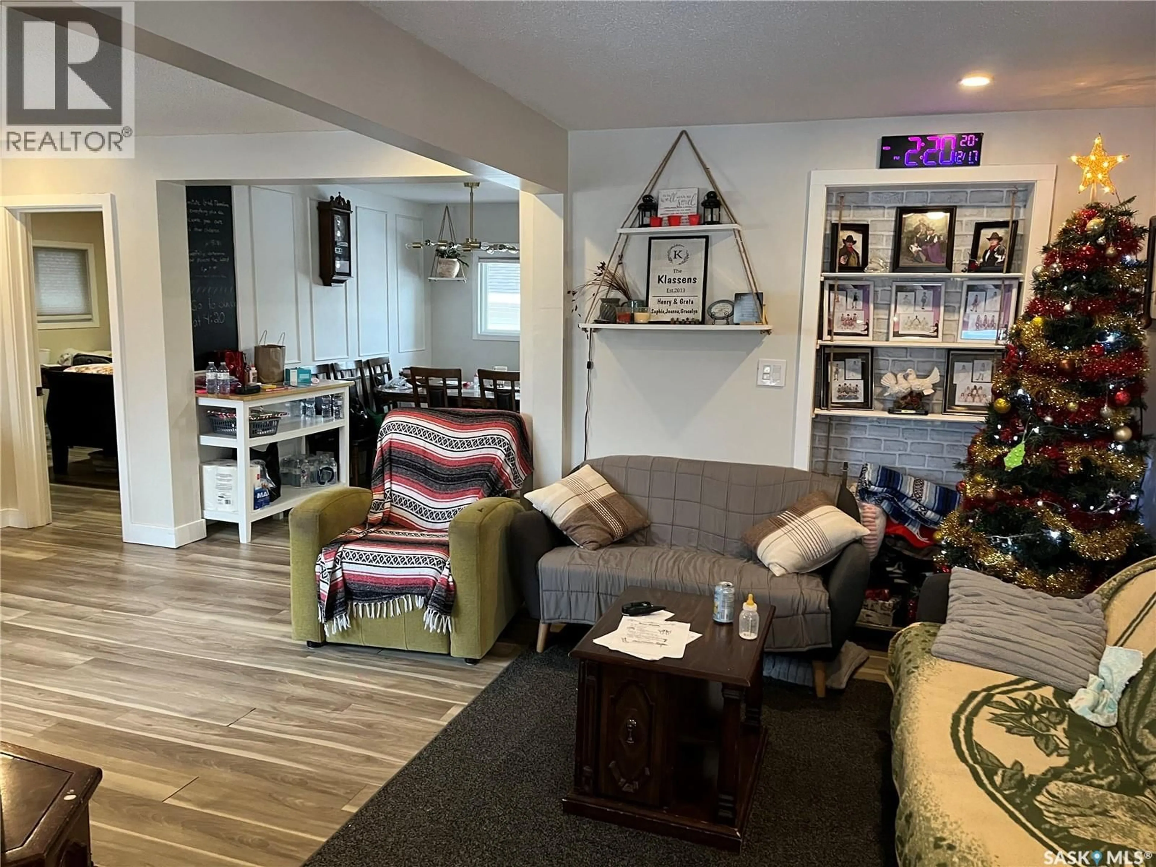 Living room with furniture, wood/laminate floor for 220 5TH AVENUE, Gravelbourg Saskatchewan S0H1X0