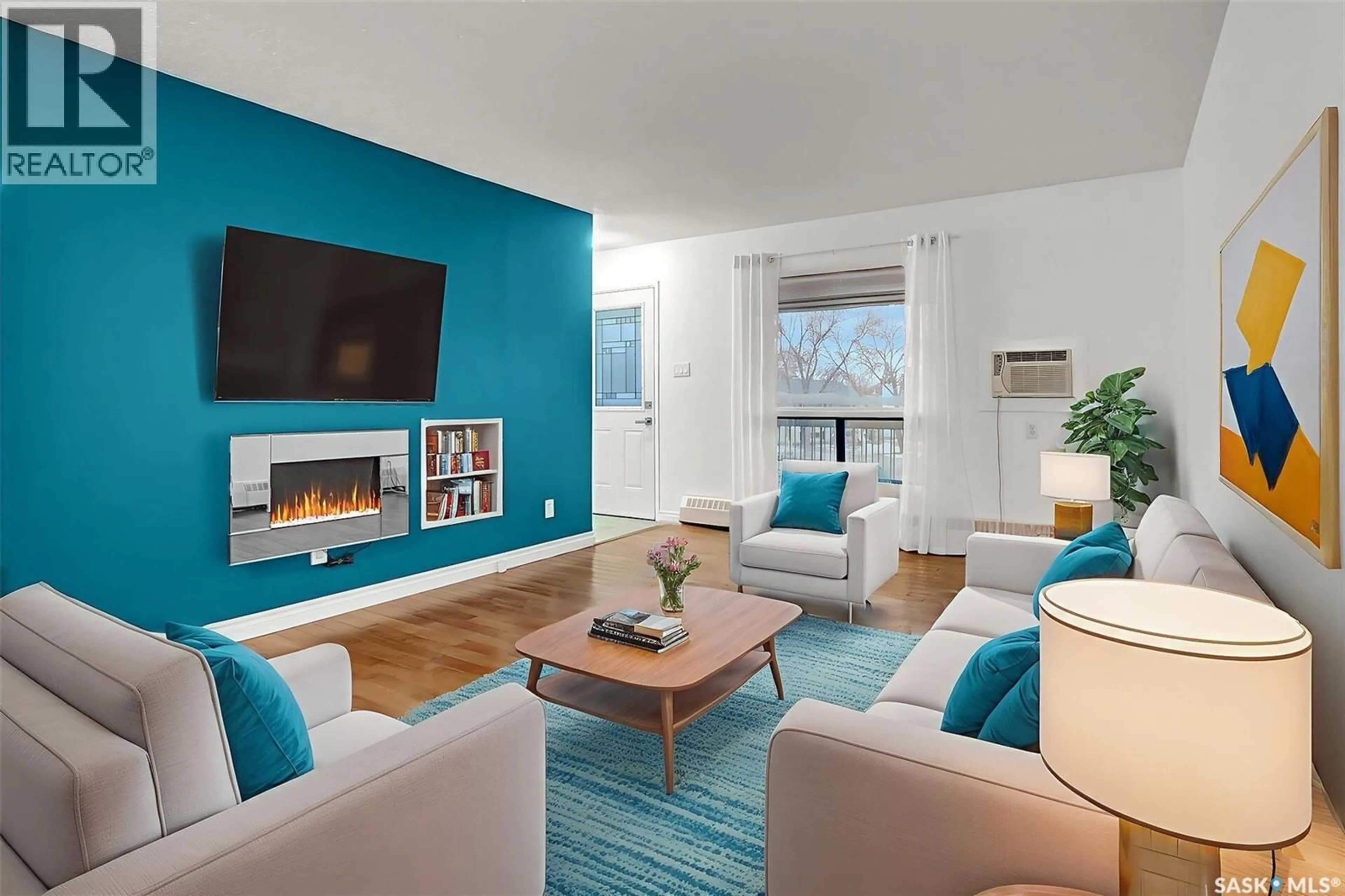 Living room with furniture, wood/laminate floor for 54B NOLLET AVENUE, Regina Saskatchewan S4T7P9