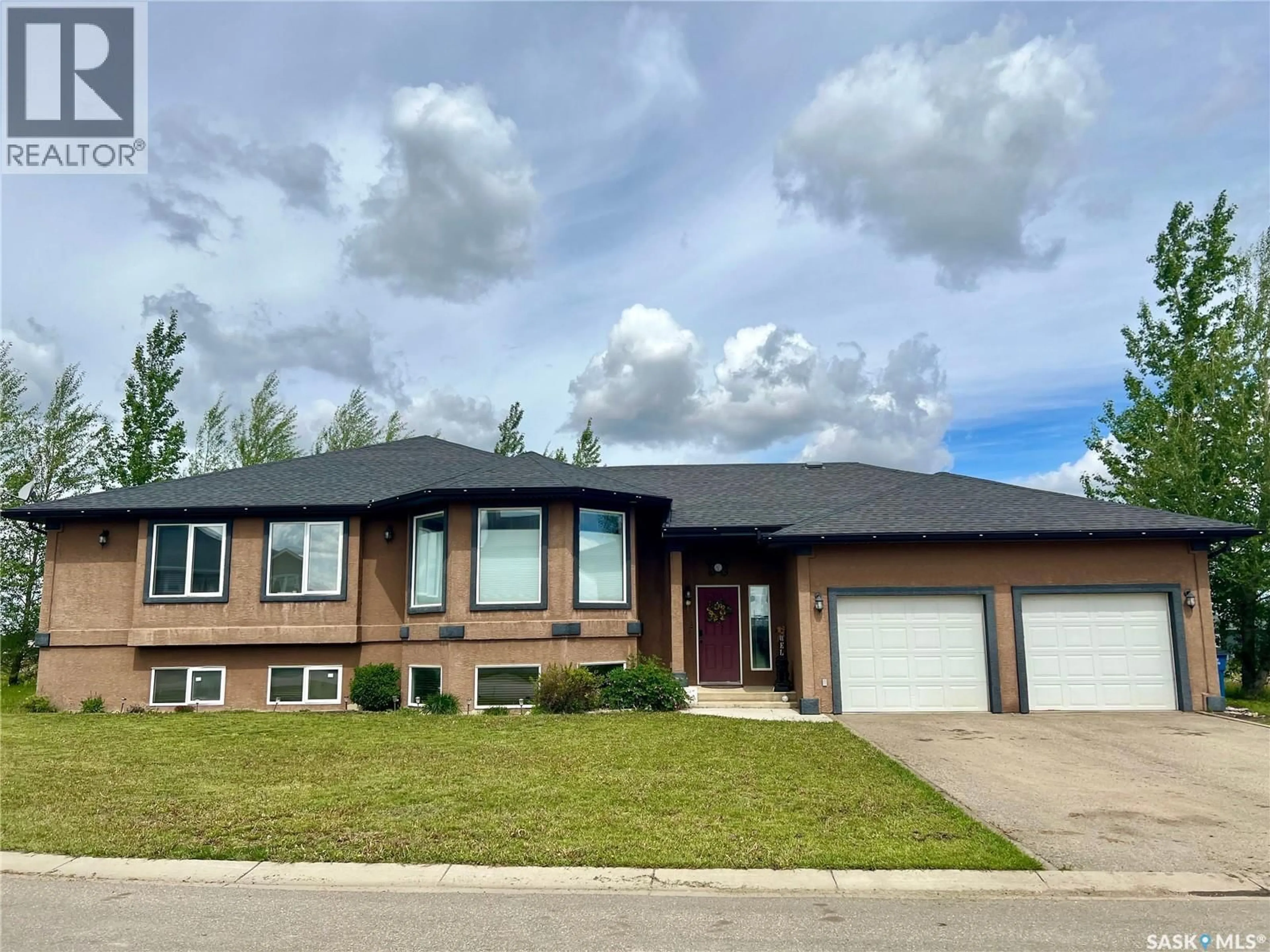 Home with vinyl exterior material, street for 1 POPLAR CRESCENT, Birch Hills Saskatchewan S0J0G0