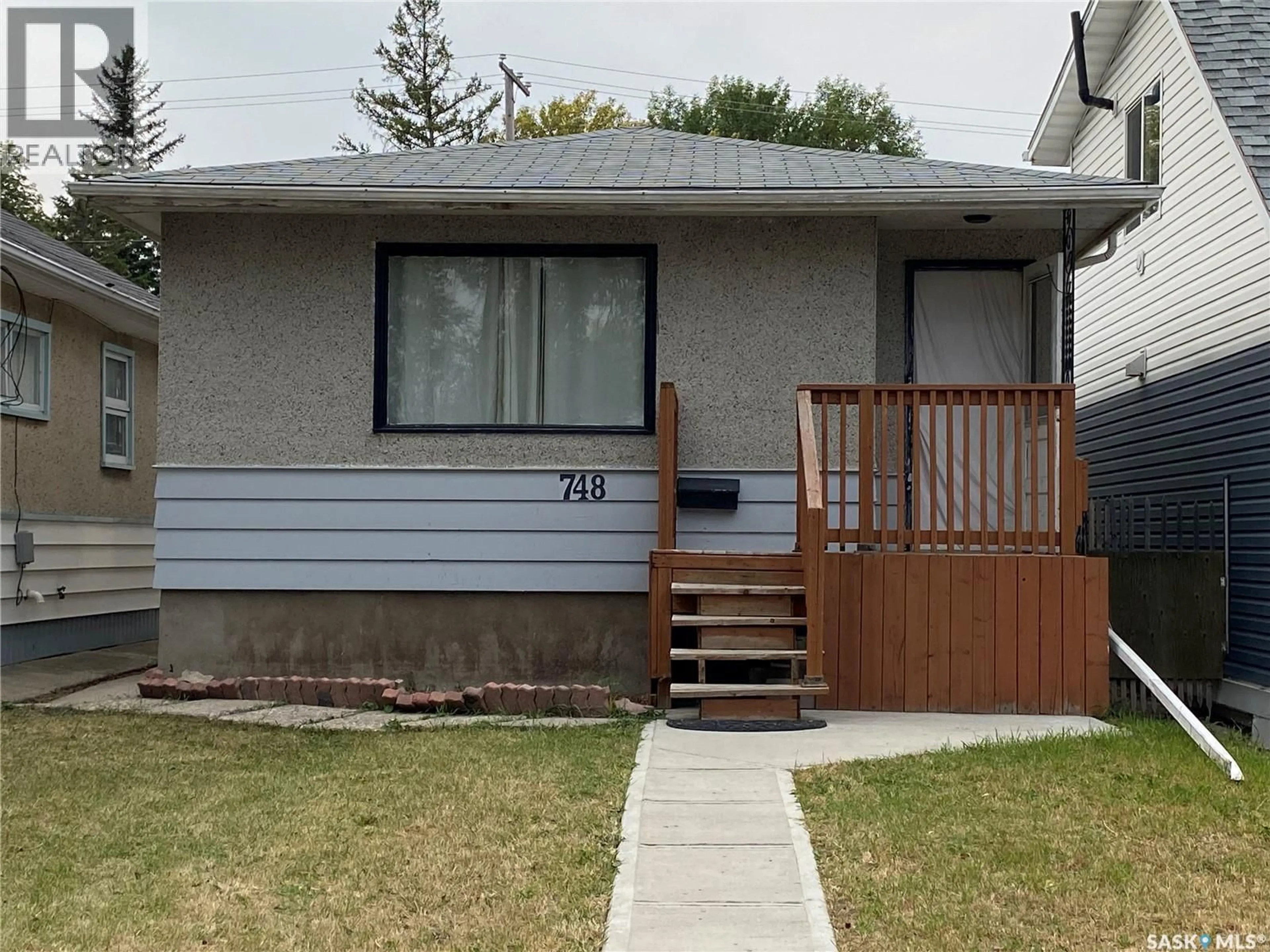 Home with vinyl exterior material, street for 748 RAE STREET, Regina Saskatchewan S4T2A9