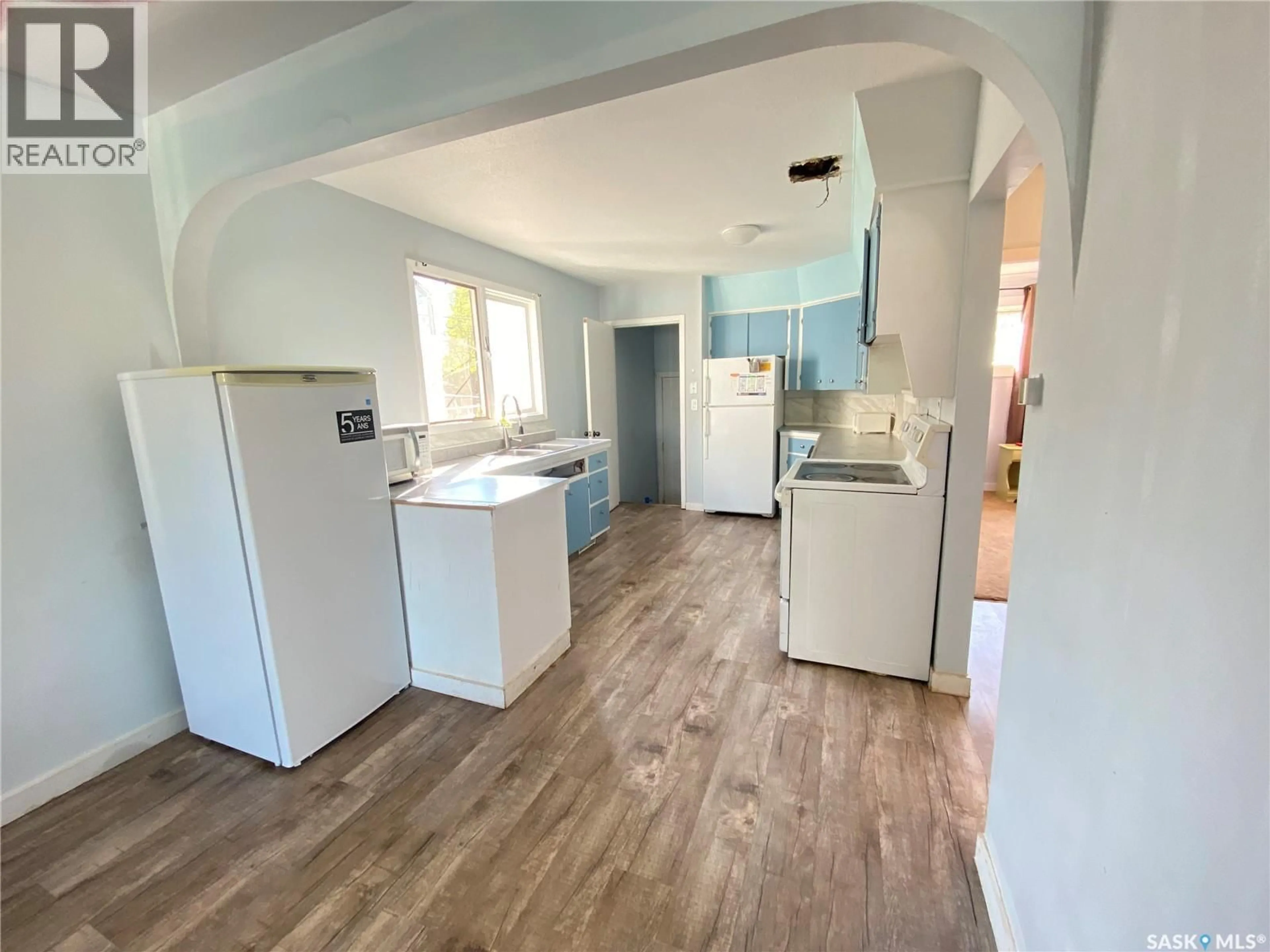 Kitchen with laundary machines, unknown for 748 RAE STREET, Regina Saskatchewan S4T2A9