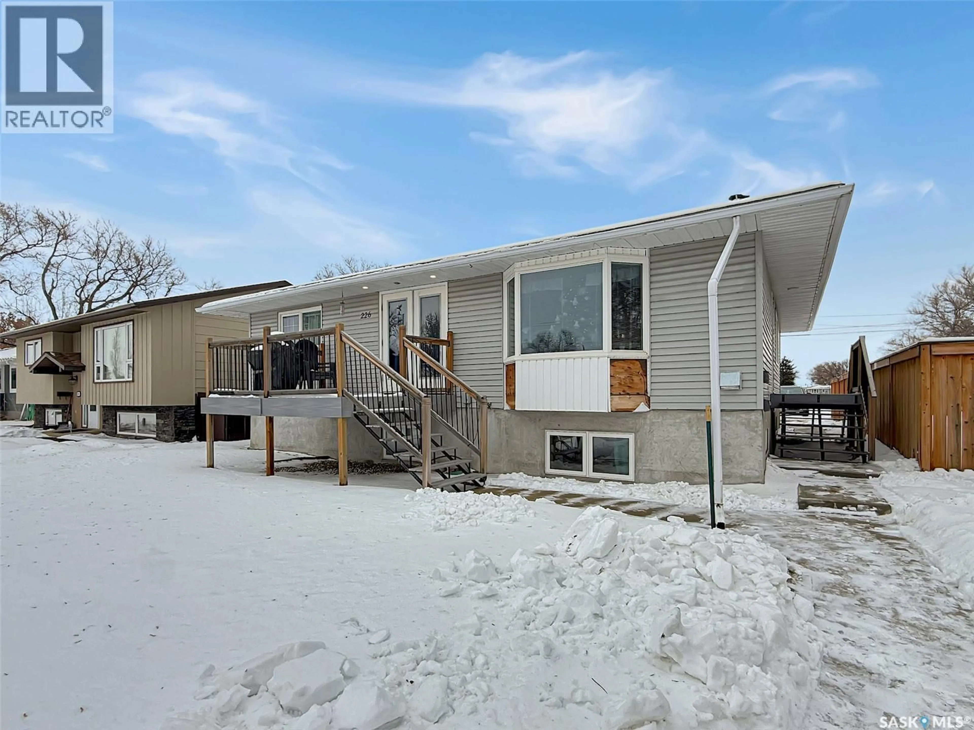 Home with vinyl exterior material, street for 226 4TH AVENUE, Swift Current Saskatchewan S9H3L5