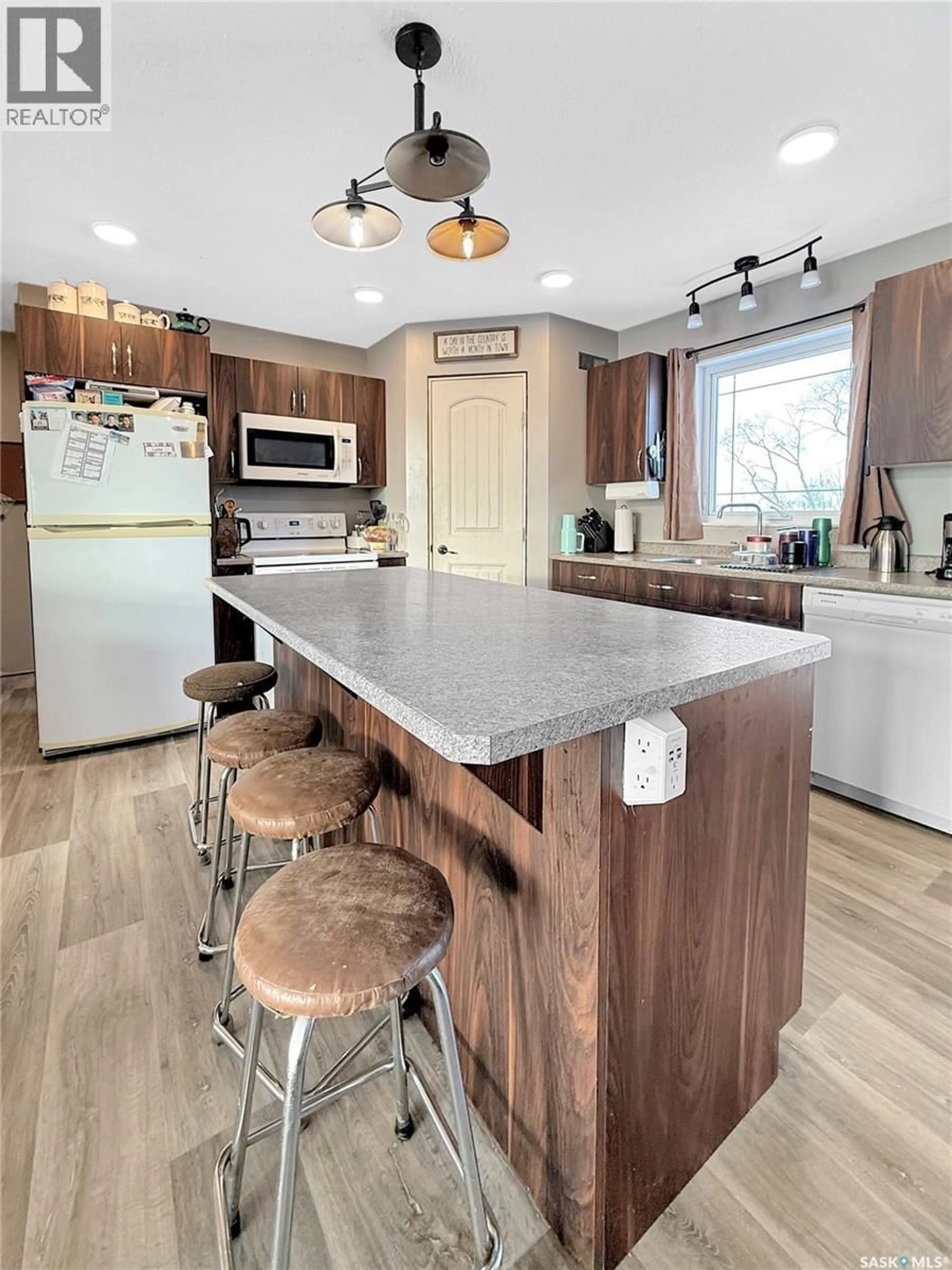 Open concept kitchen, wood/laminate floor for PADDOCKWOOD ACREAGE, Paddockwood Rm No. 520 Saskatchewan S0J1Z0