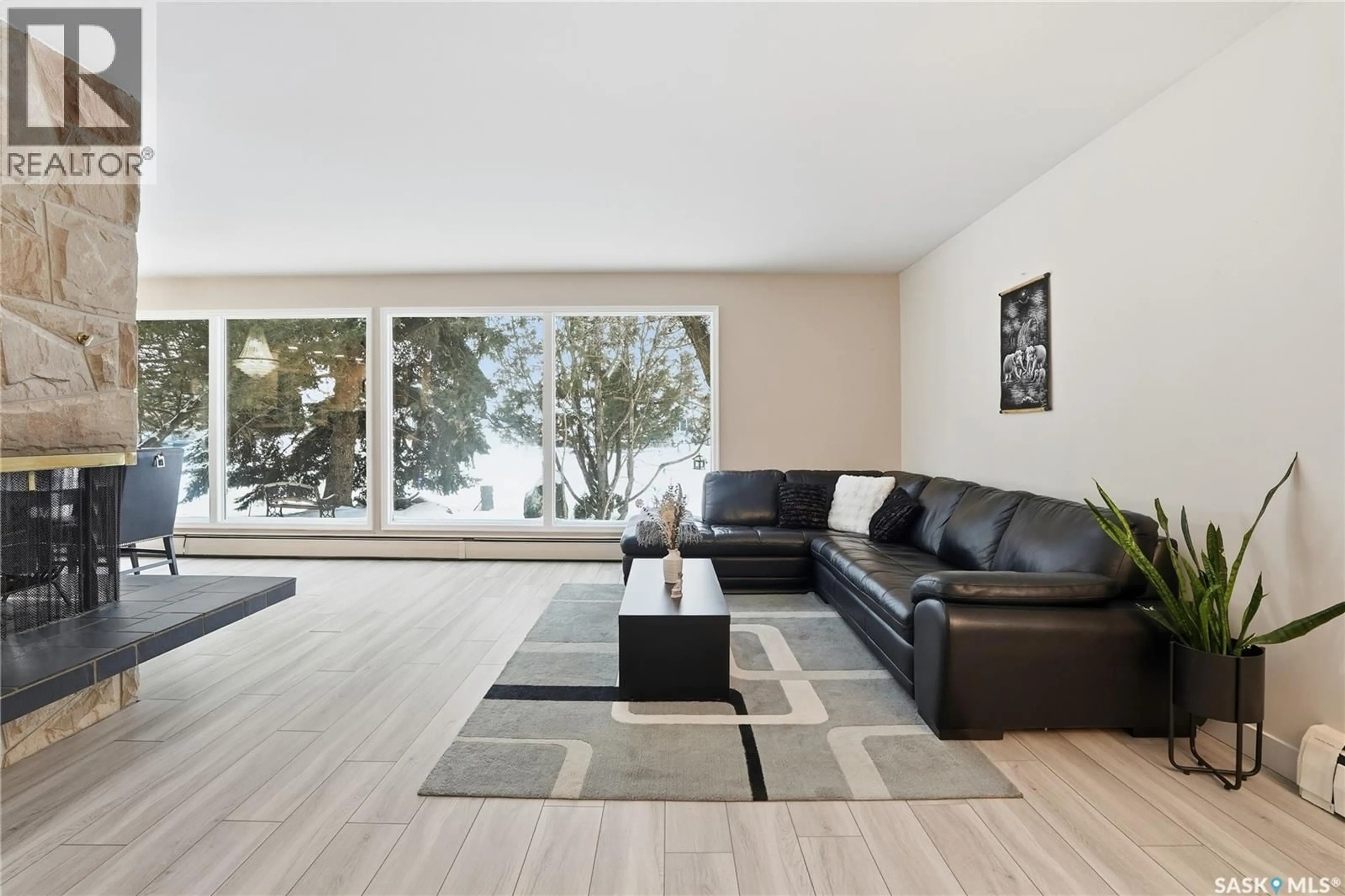 Living room with furniture, wood/laminate floor for 257 CAMPION CRESCENT, Saskatoon Saskatchewan S7H3T8