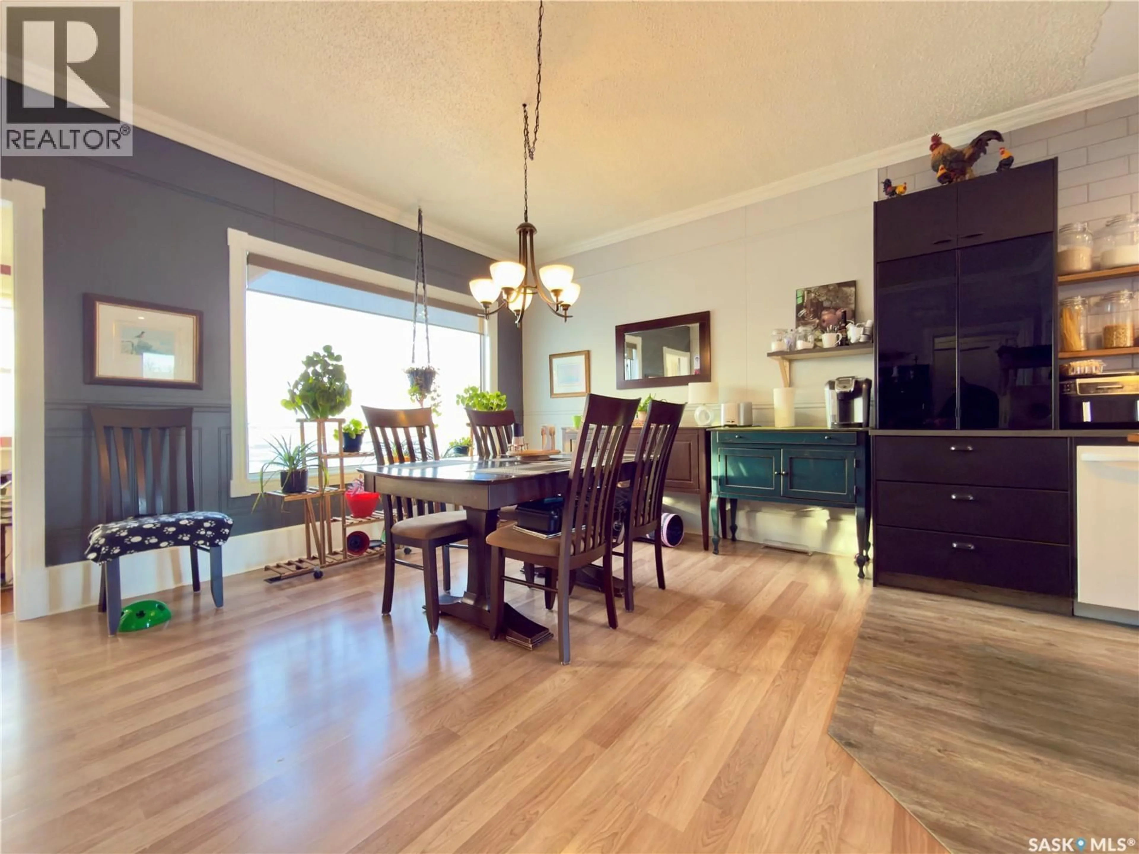 Dining room, wood/laminate floor for SUTTON ACREAGE, Sutton Rm No. 103 Saskatchewan S0H1X0