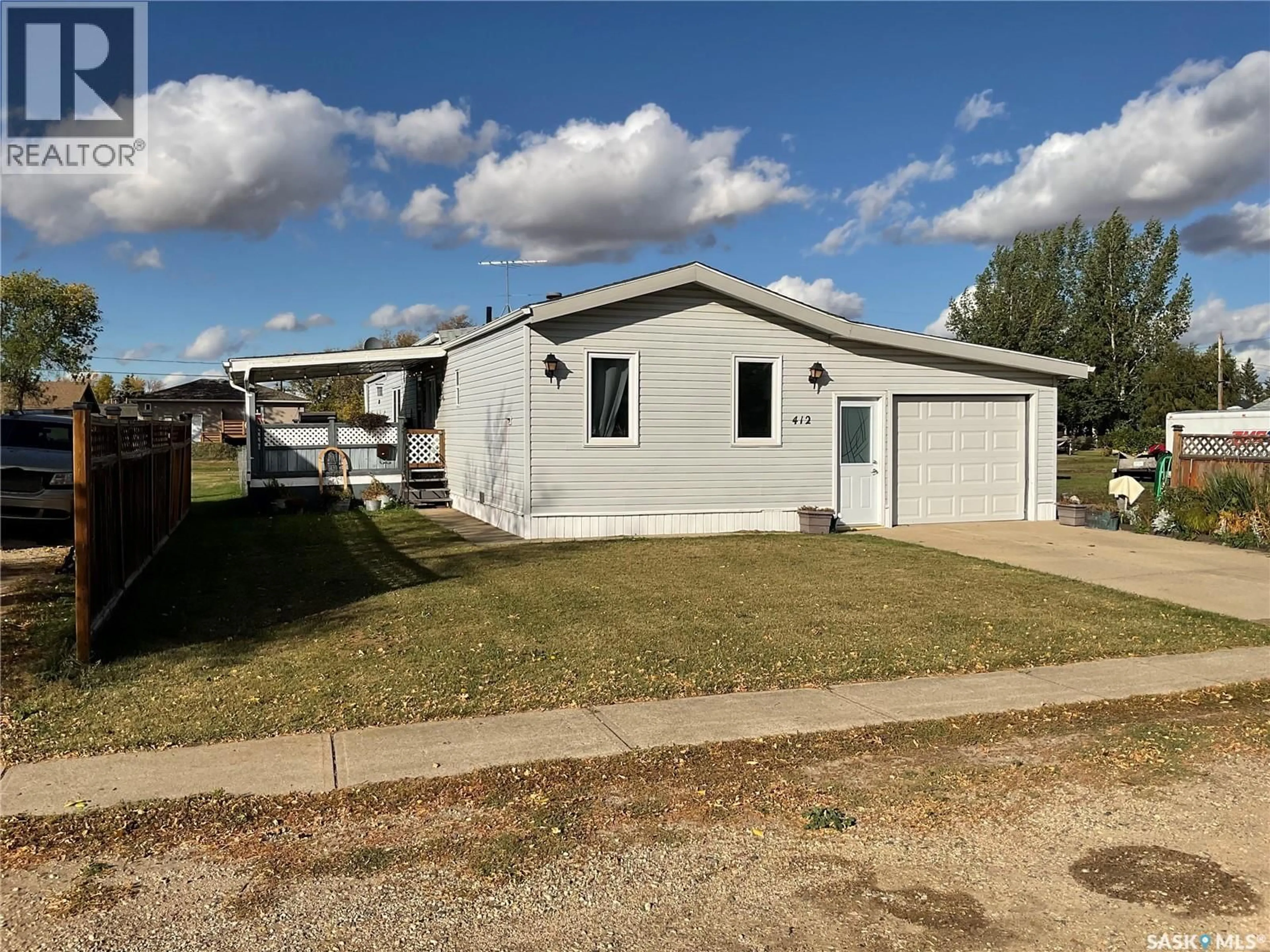 Home with vinyl exterior material, street for 412 MAIN STREET, Wakaw Saskatchewan S0K4P0