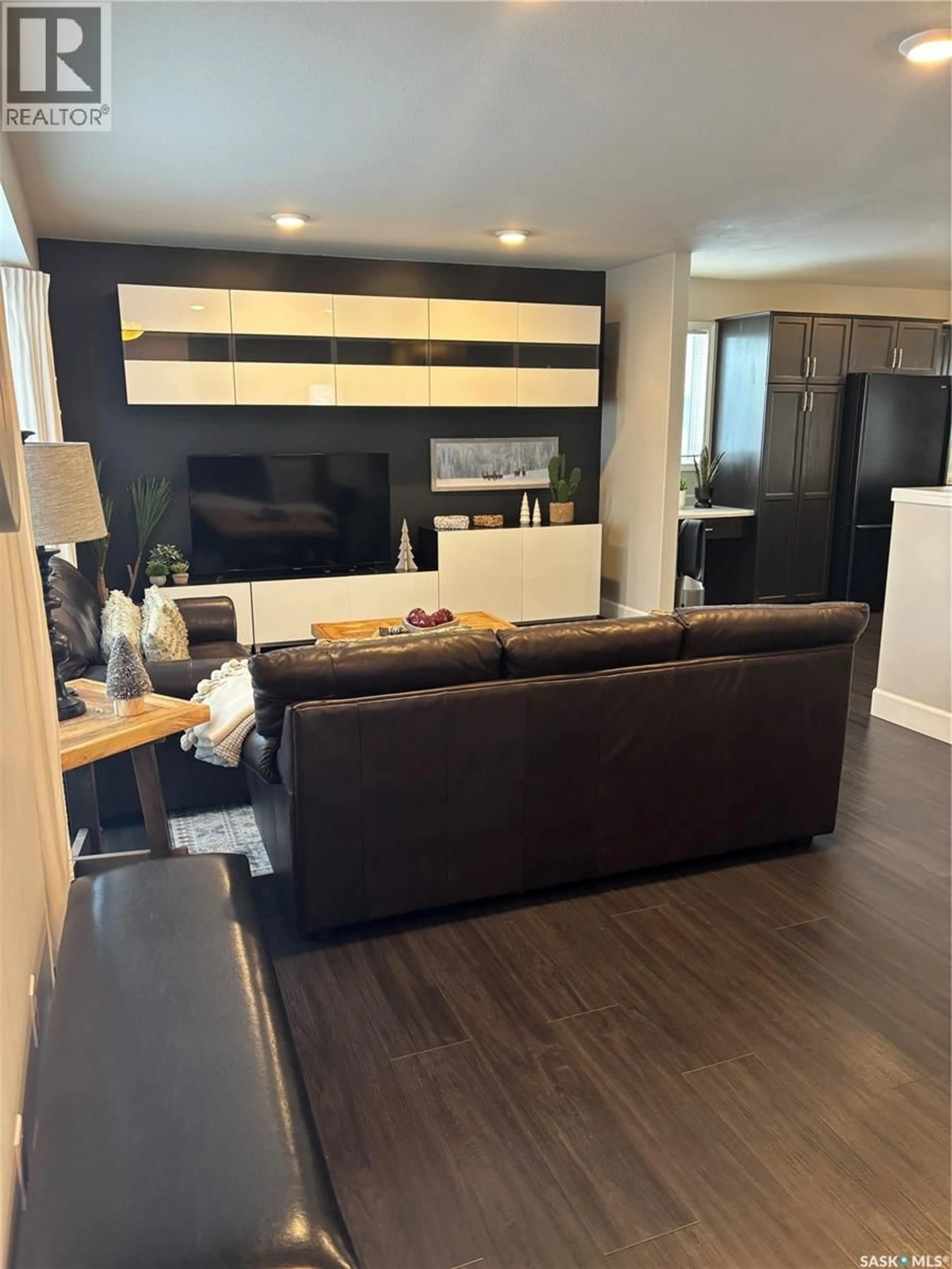 Living room with furniture, wood/laminate floor for 605 PARK AVENUE, Melfort Saskatchewan S0E1A0