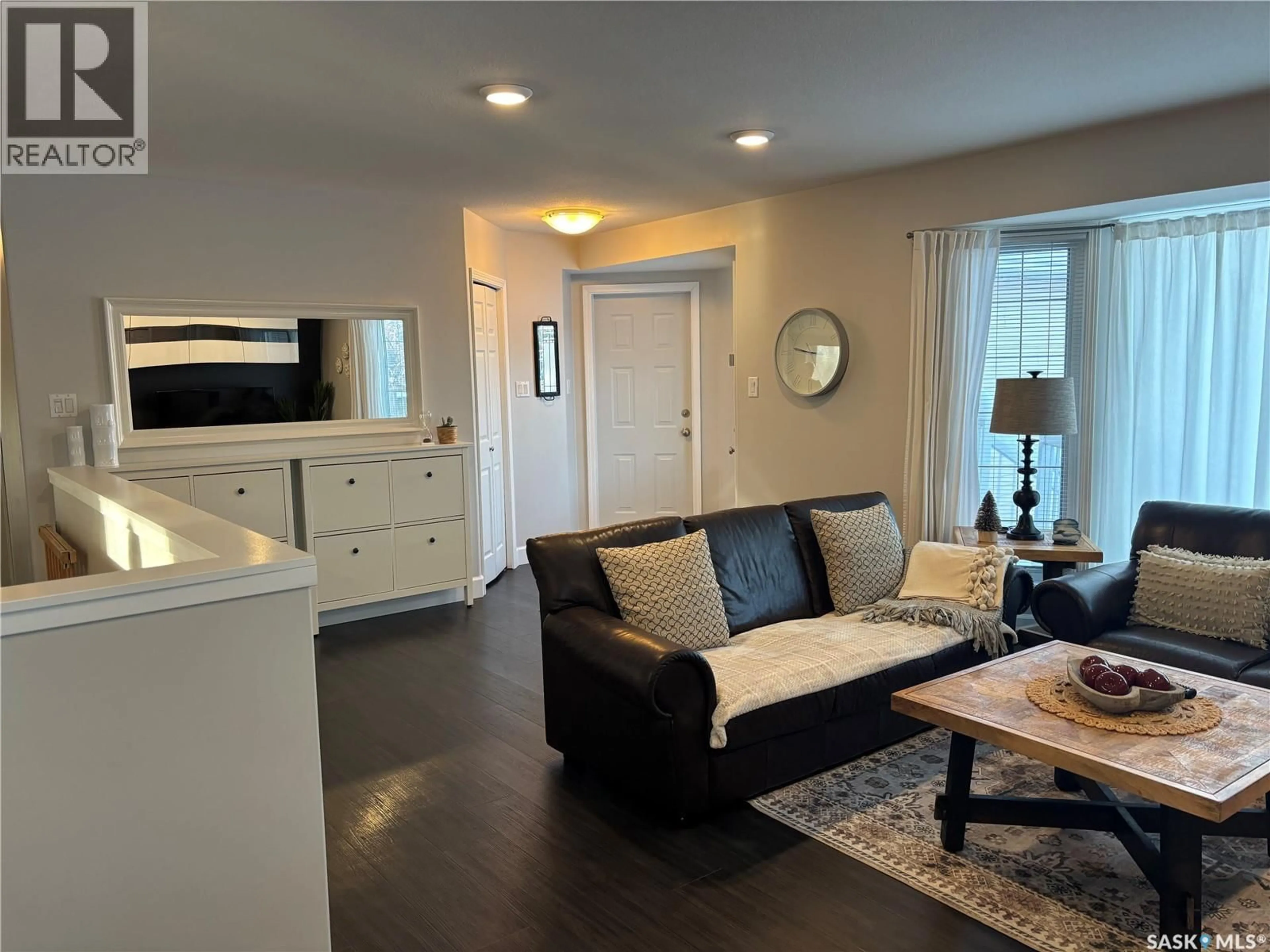 Living room with furniture, wood/laminate floor for 605 PARK AVENUE, Melfort Saskatchewan S0E1A0