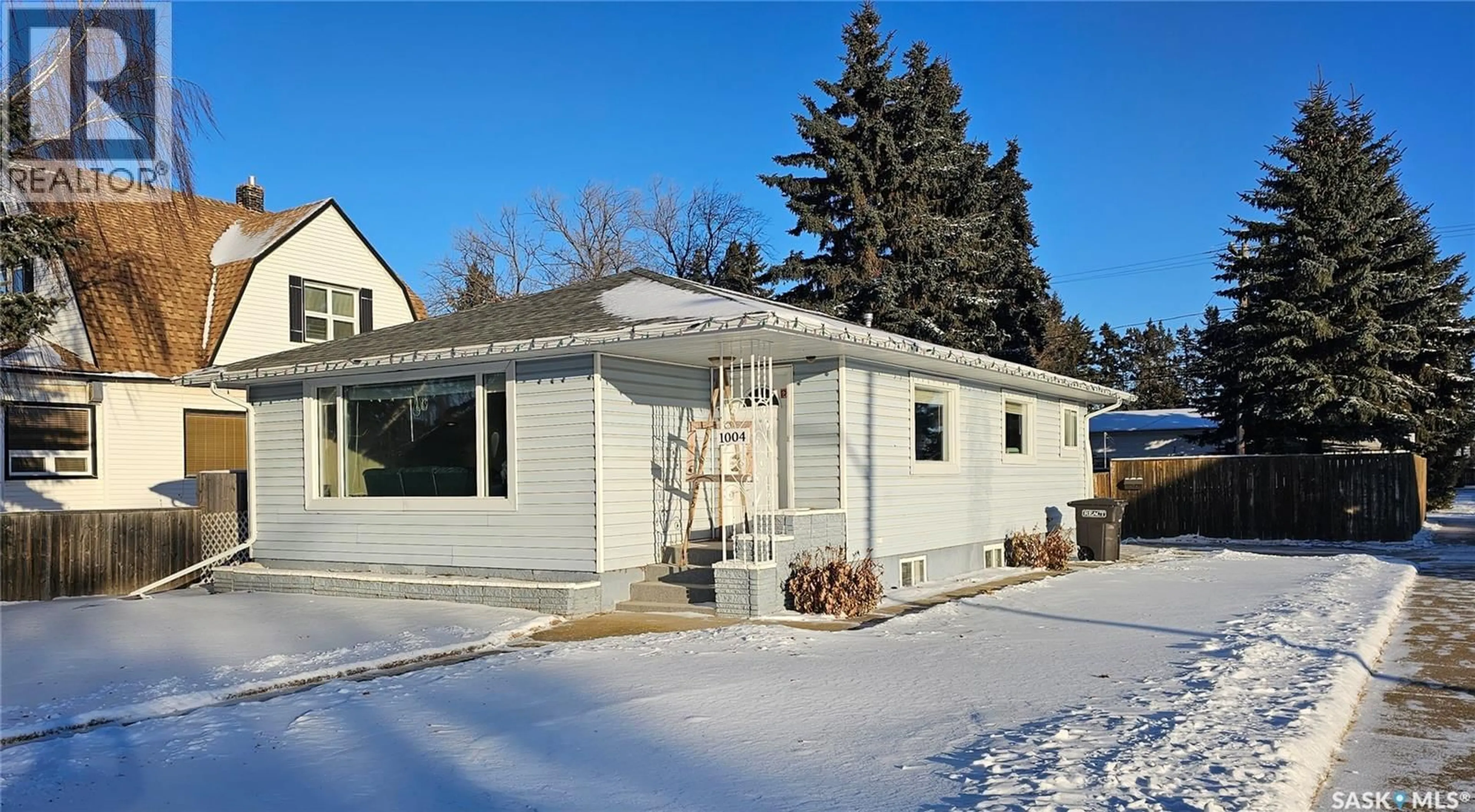 Home with vinyl exterior material, street for 1004 9TH STREET, Humboldt Saskatchewan S0K2A0