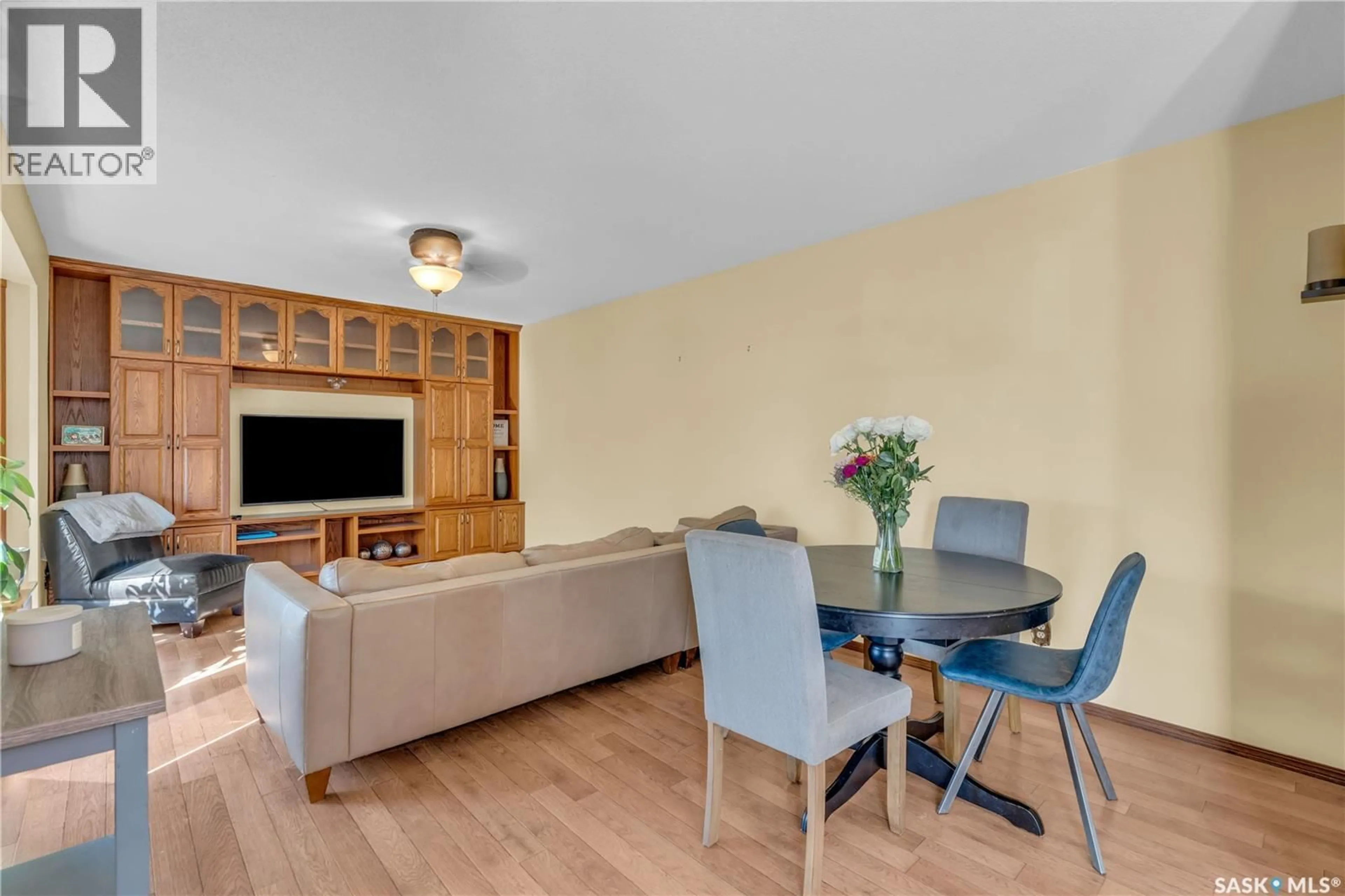 Living room with furniture, wood/laminate floor for 901 CONNAUGHT AVENUE, Limerick Saskatchewan S0H2P0