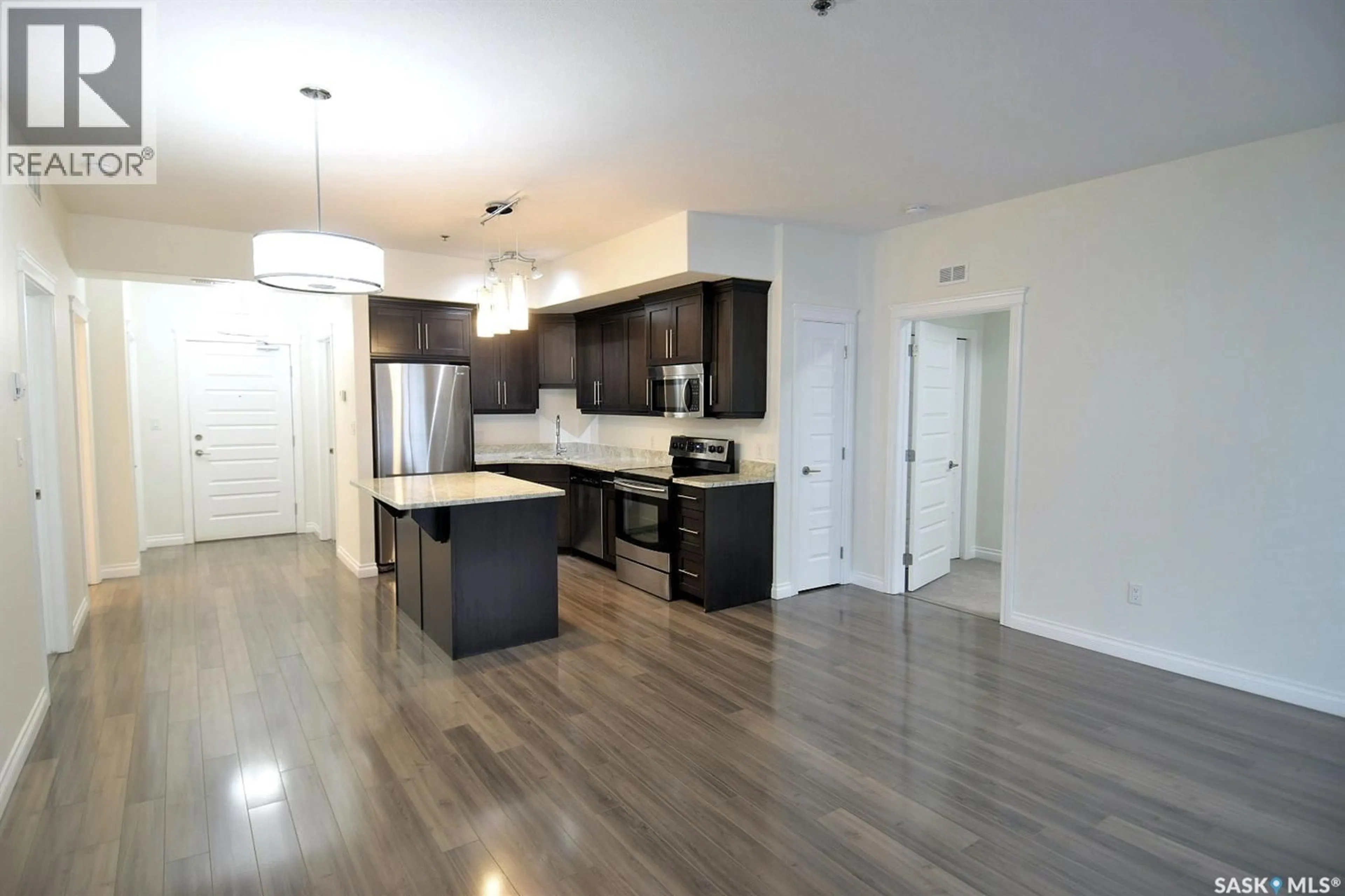 Open concept kitchen, wood/laminate floor for 419 - 307 NELSON ROAD, Saskatoon Saskatchewan S7S1P2