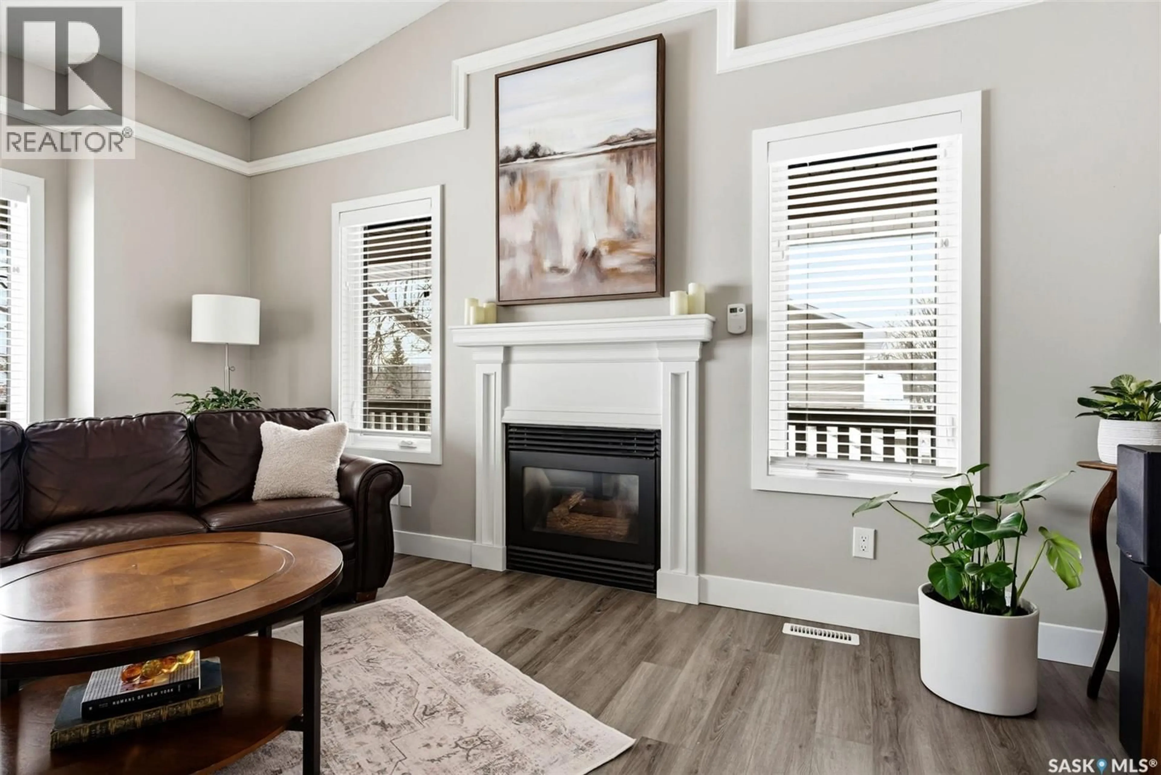 Living room with furniture, wood/laminate floor for 30 COTTONWOOD PLACE, Lumsden Saskatchewan S0G3C0
