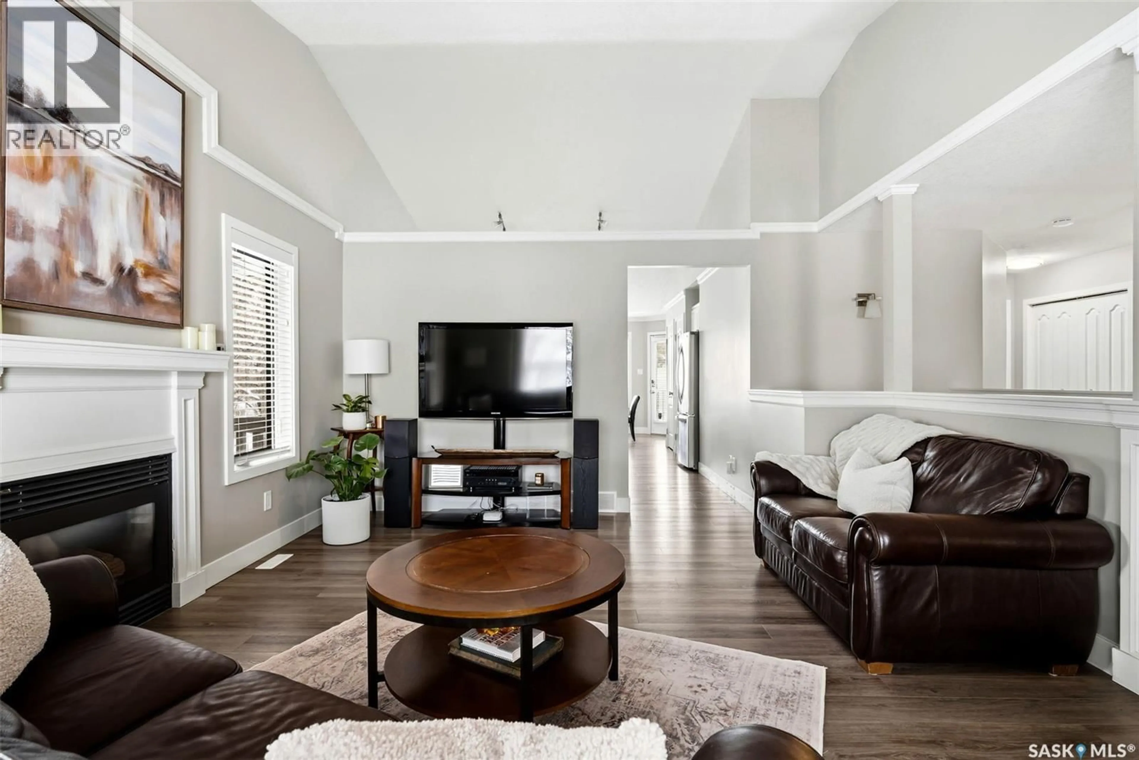 Living room with furniture, wood/laminate floor for 30 COTTONWOOD PLACE, Lumsden Saskatchewan S0G3C0