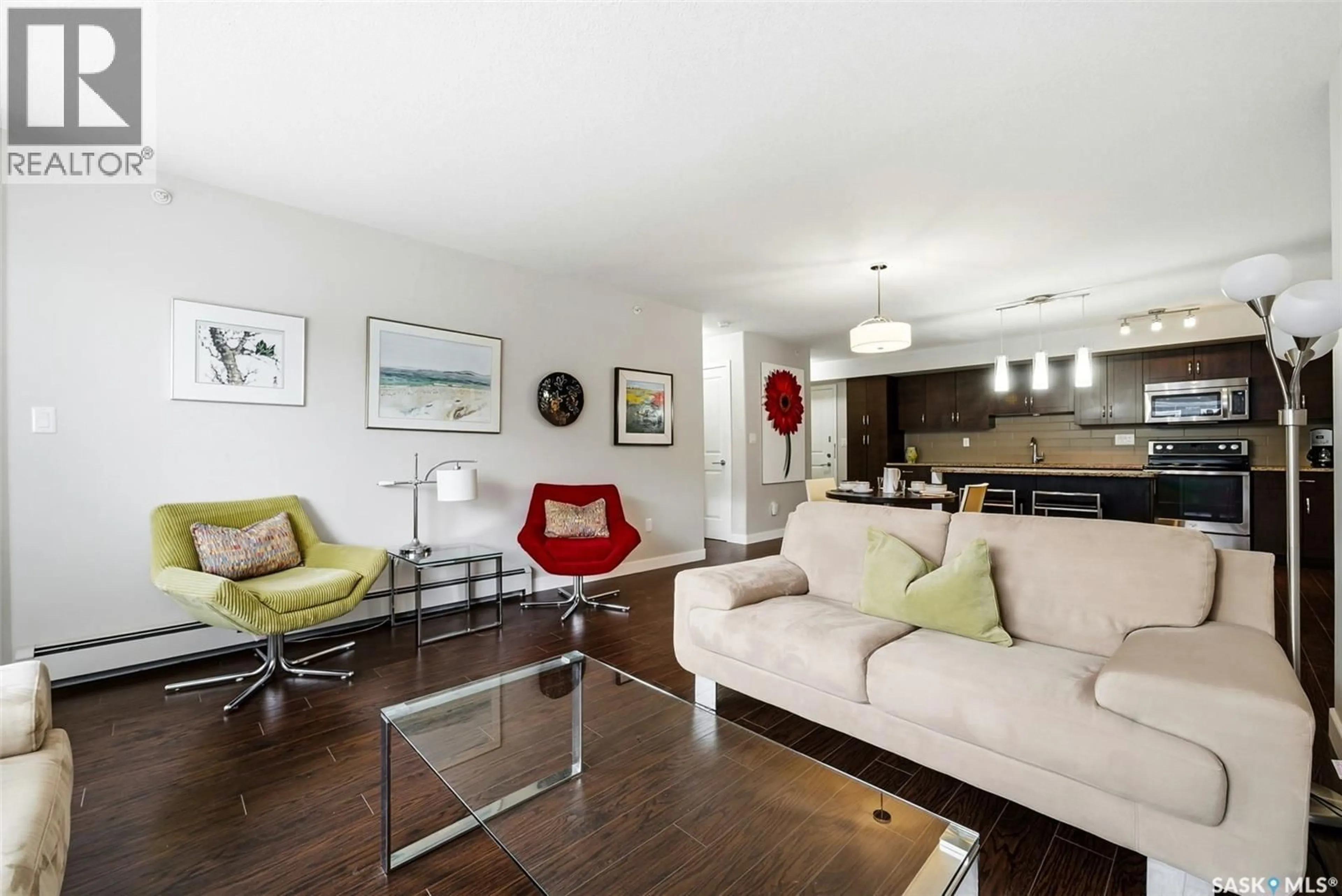 Living room with furniture, wood/laminate floor for 309 - 2321 WINDSOR PARK ROAD, Regina Saskatchewan S4V3N2
