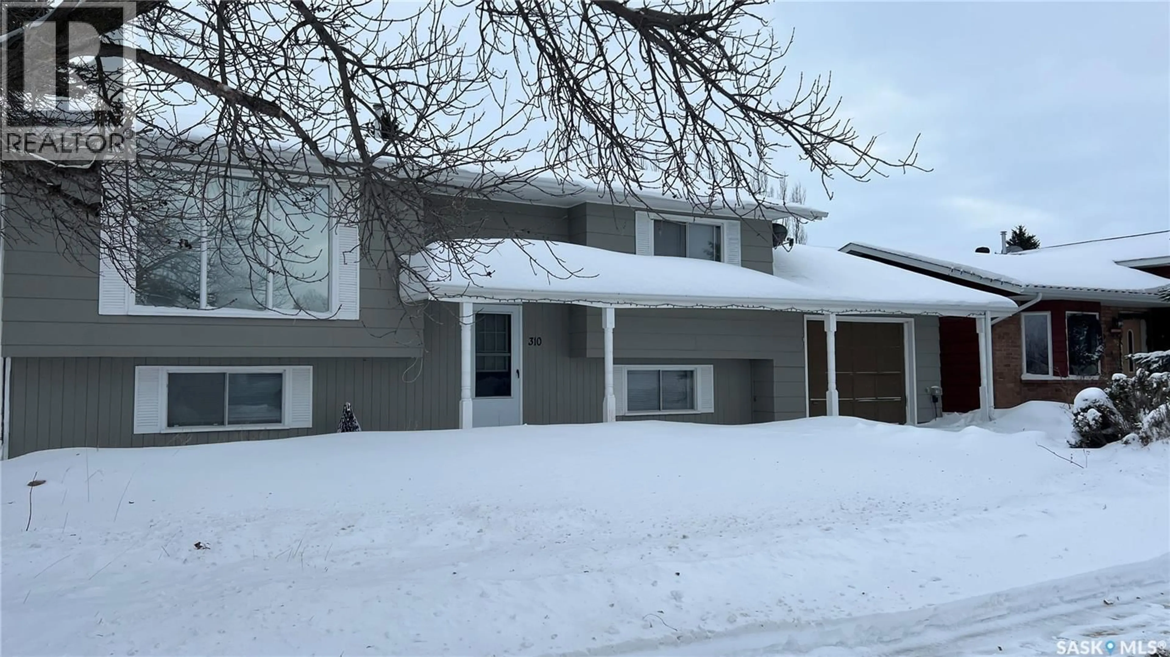 Home with vinyl exterior material, street for 310 5TH AVENUE, Cudworth Saskatchewan S0K1B0