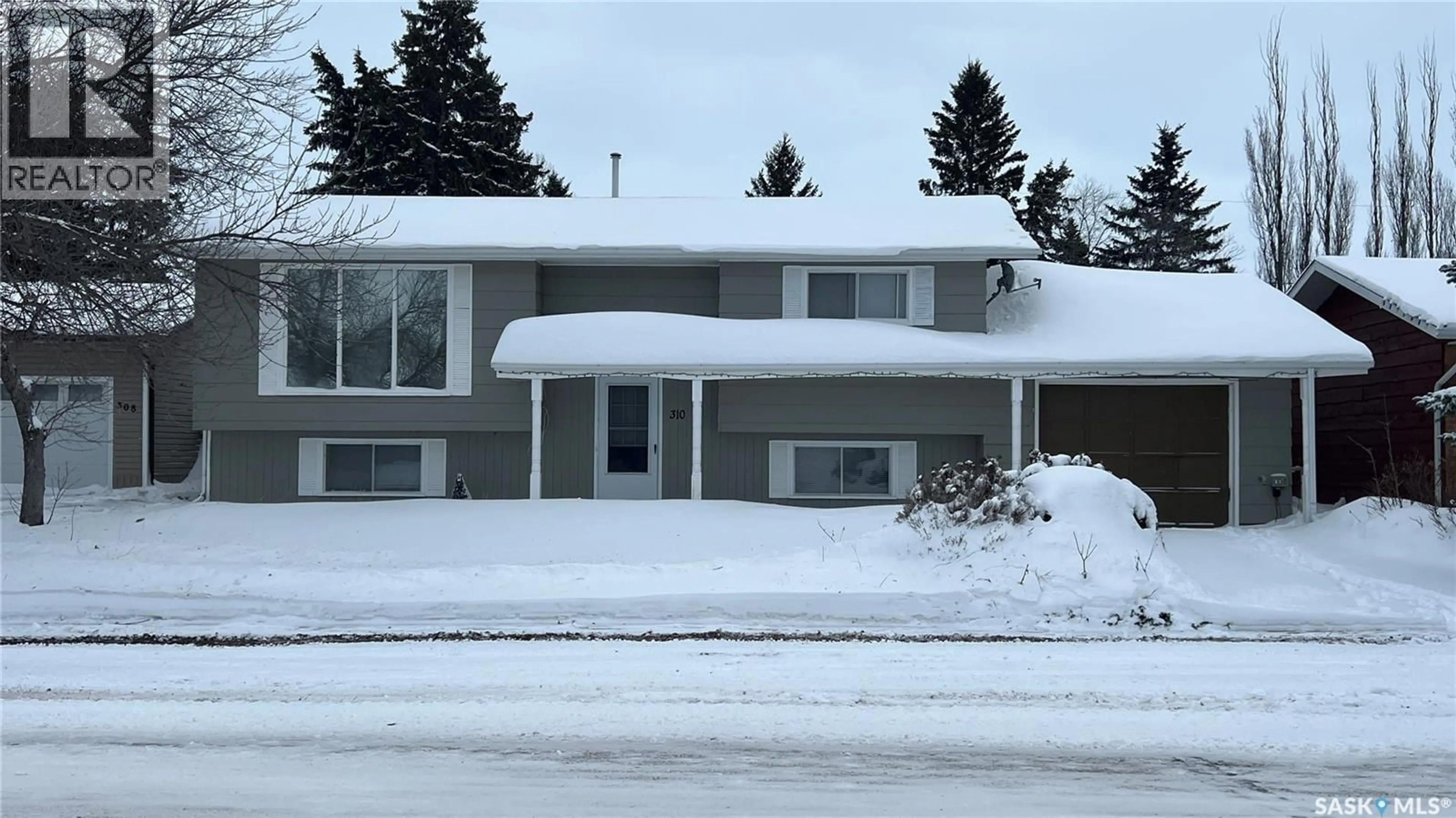 Home with vinyl exterior material, street for 310 5TH AVENUE, Cudworth Saskatchewan S0K1B0