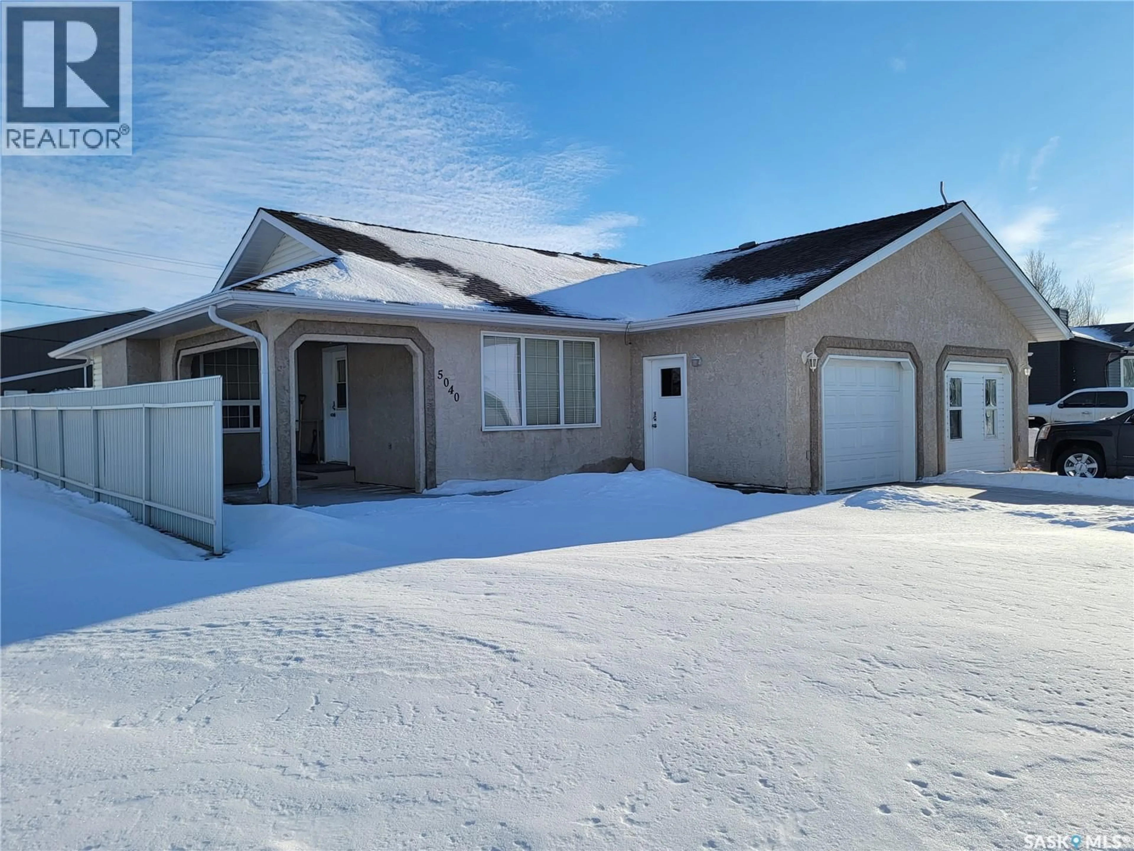 Home with vinyl exterior material, street for 5040 MIRROR DRIVE, Macklin Saskatchewan S0L2C0