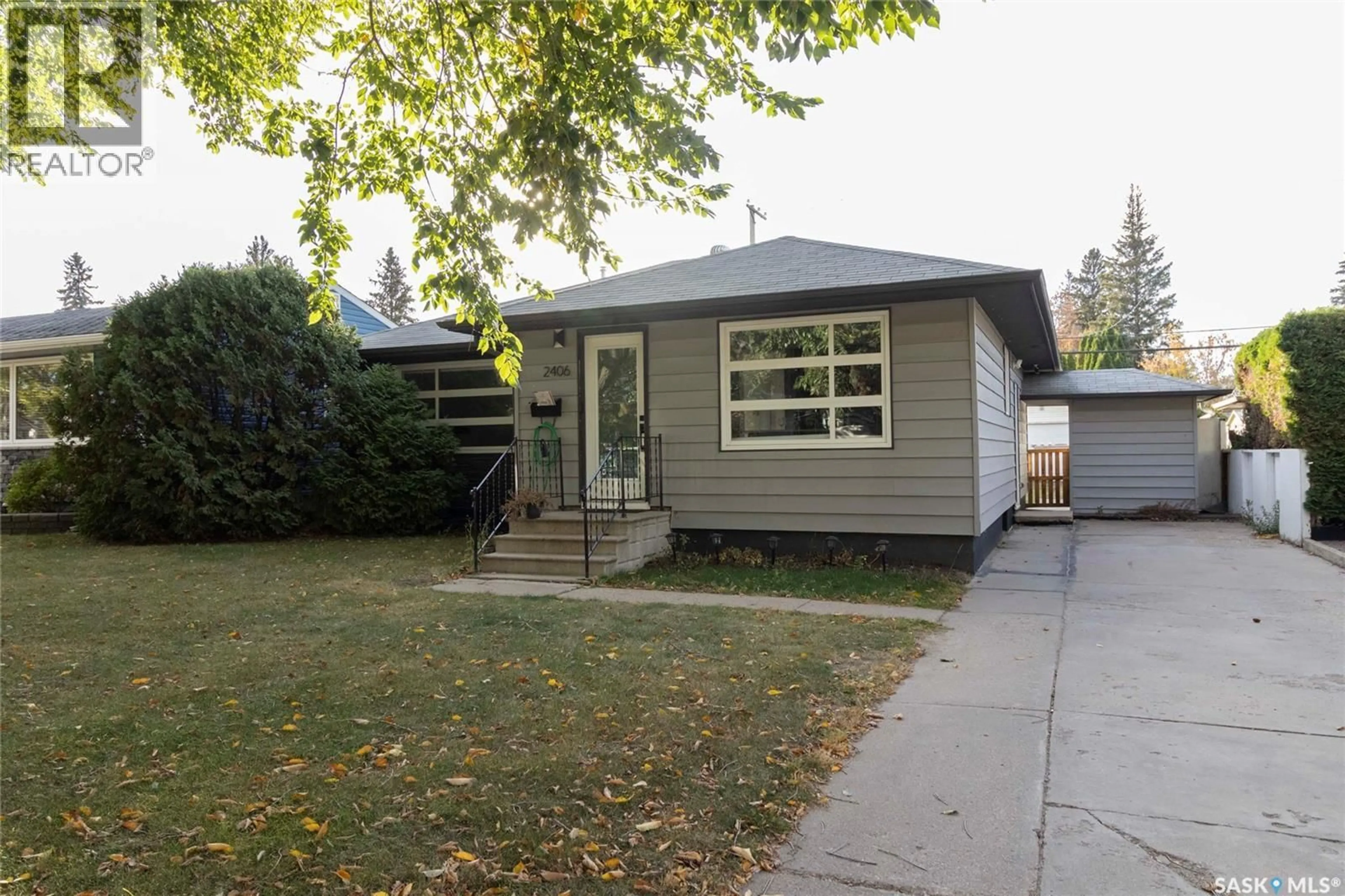 Home with vinyl exterior material, street for 2406 CAIRNS AVENUE, Saskatoon Saskatchewan S7J1V3