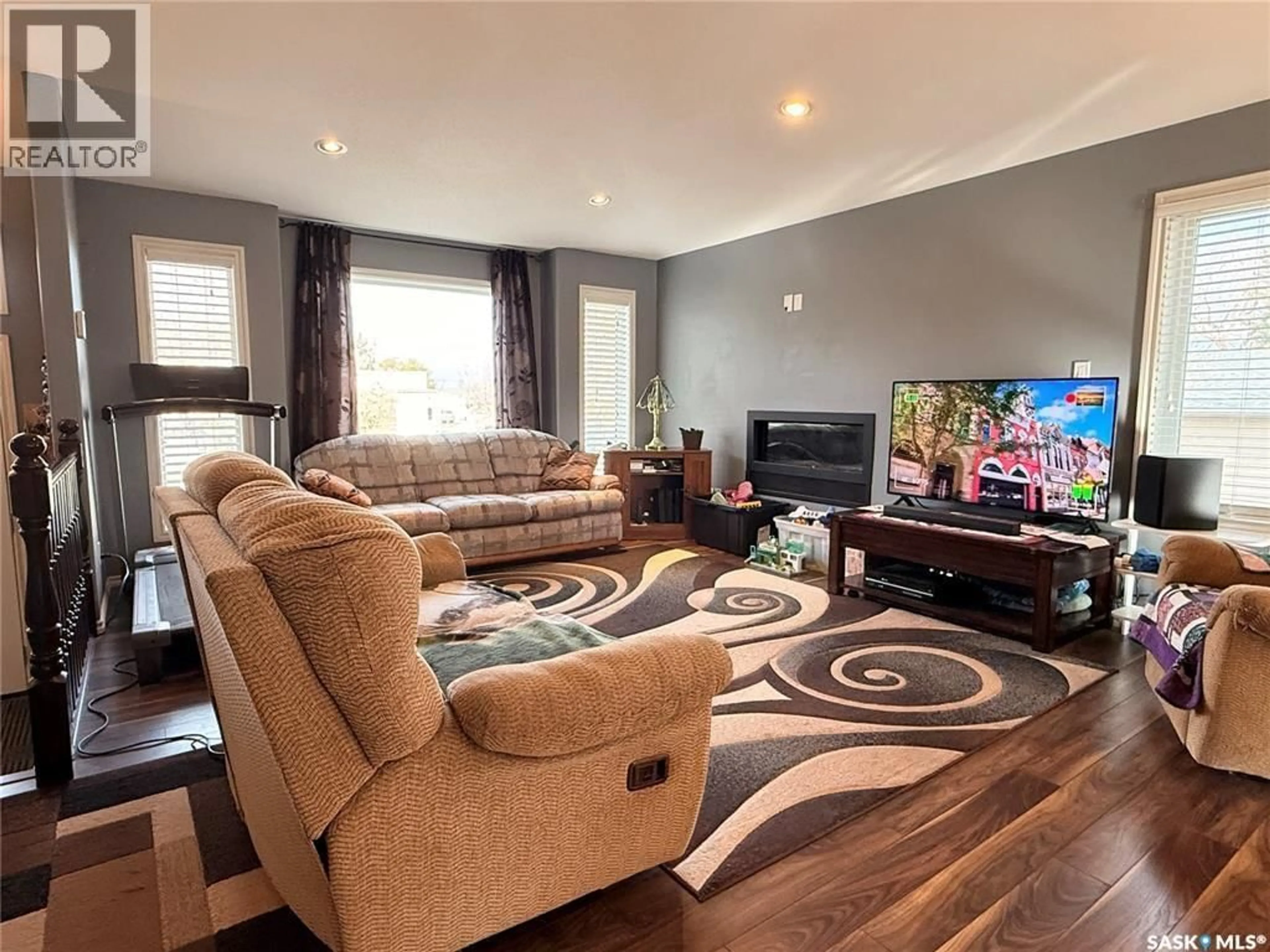 Living room with furniture, wood/laminate floor for 119 MARTIN STREET, Sedley Saskatchewan S0G4K0