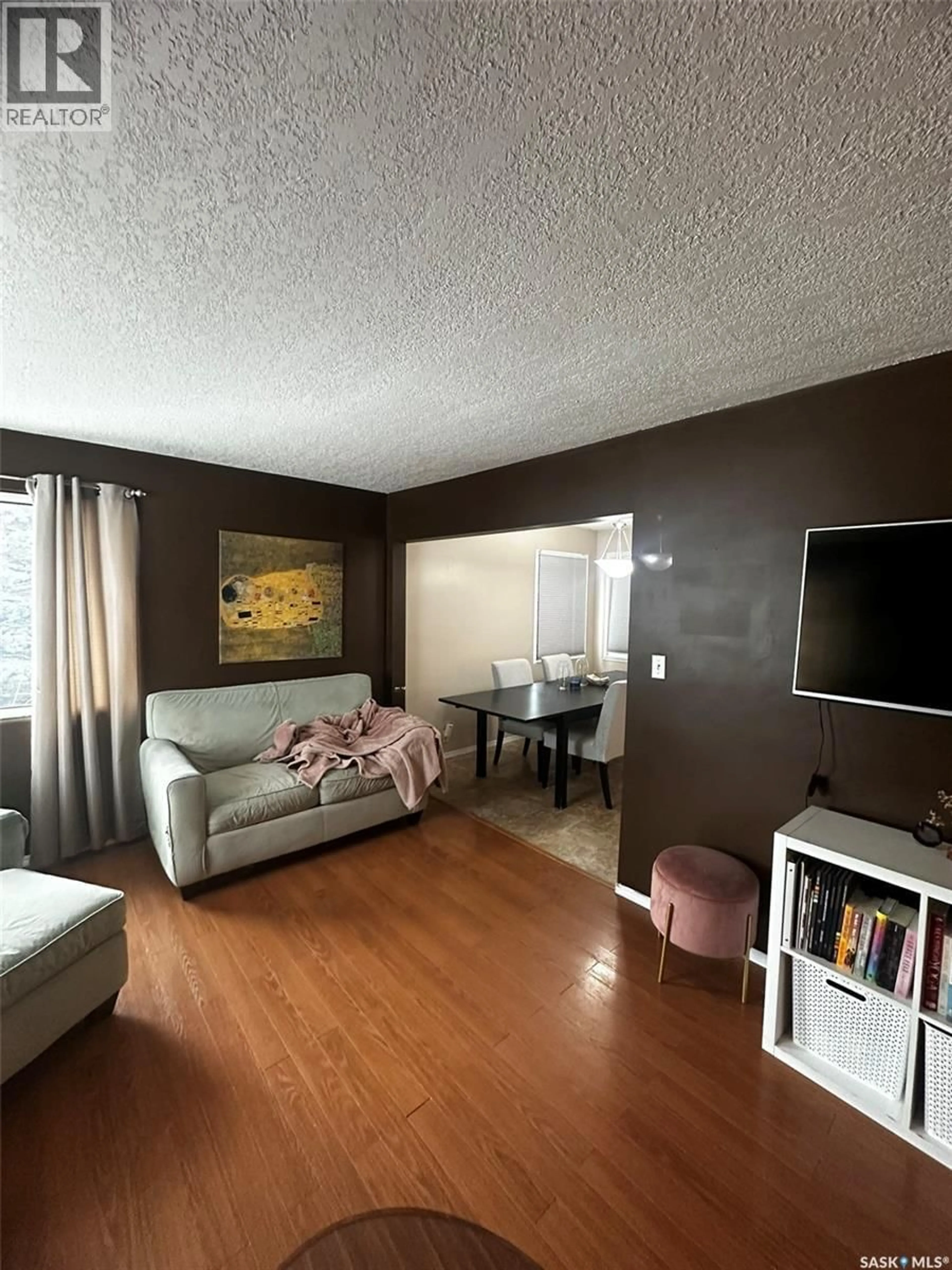 Living room with furniture, wood/laminate floor for 329 SIXTH STREET, Wadena Saskatchewan S0A4J0