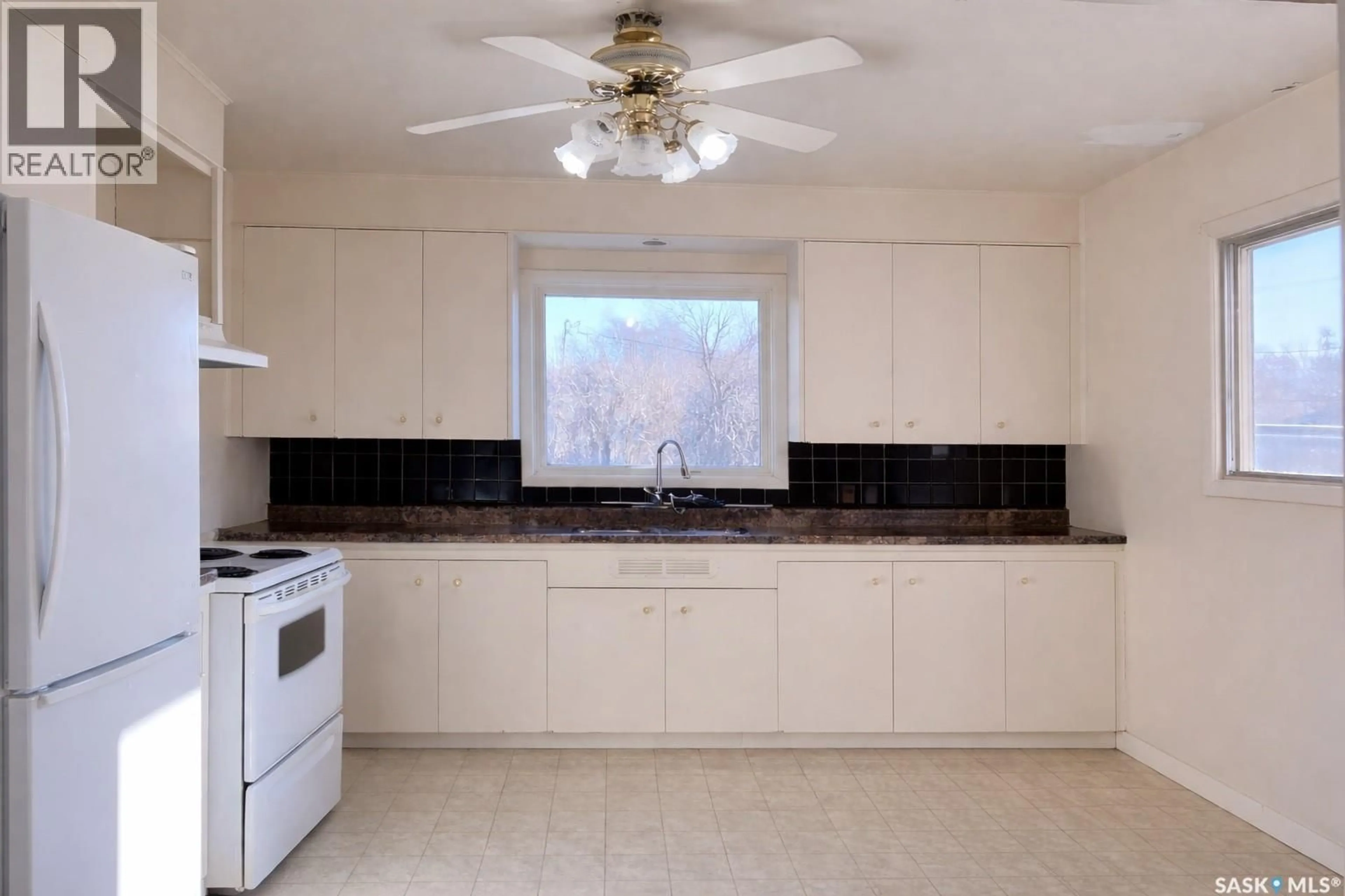 Open concept kitchen, ceramic/tile floor for 606 2ND AVENUE, Raymore Saskatchewan S0A3J0