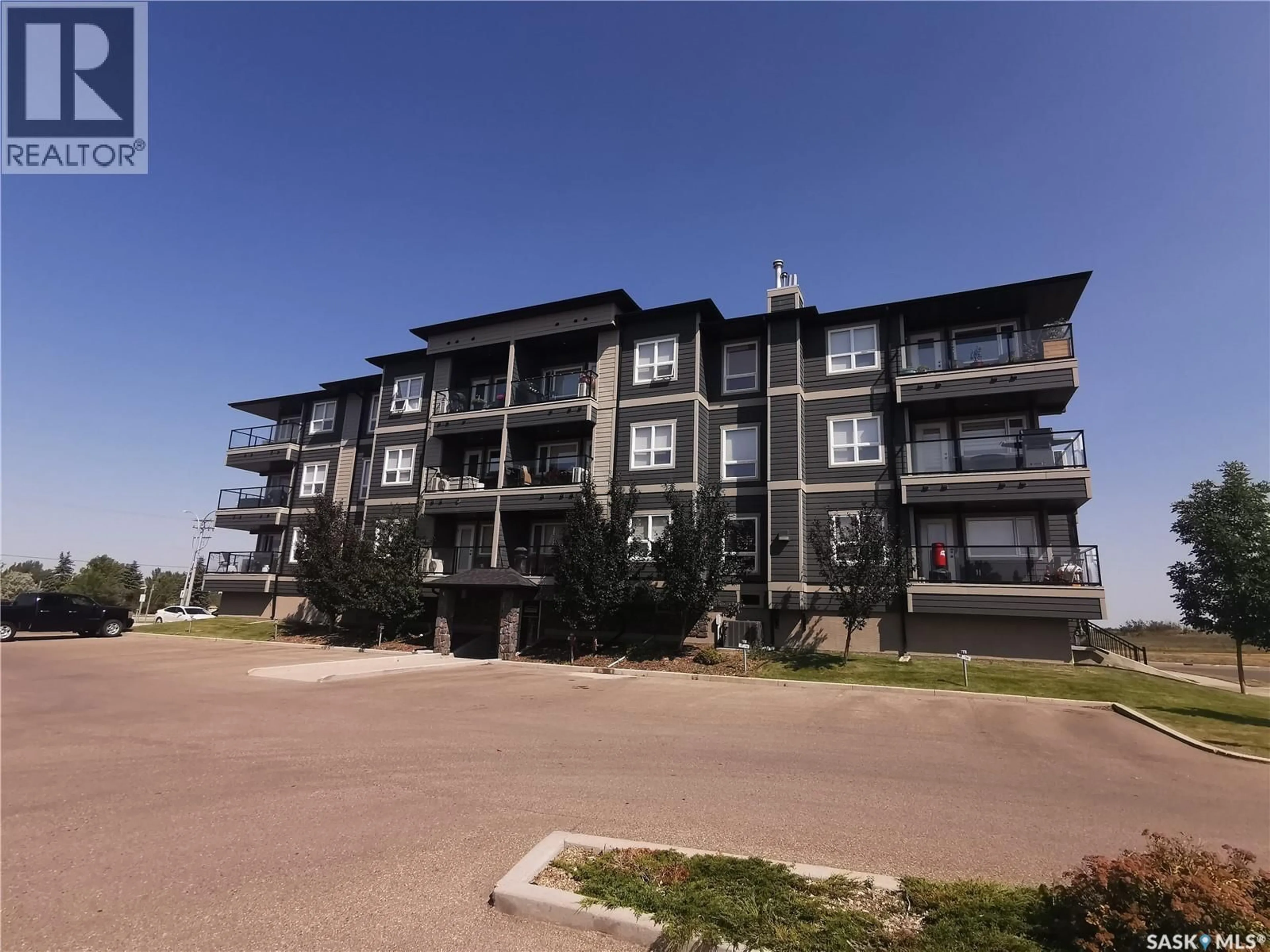 A pic from outside/outdoor area/front of a property/back of a property/a pic from drone, building for 923 - 307 KRISTJANSON ROAD, Saskatoon Saskatchewan S7S0A9