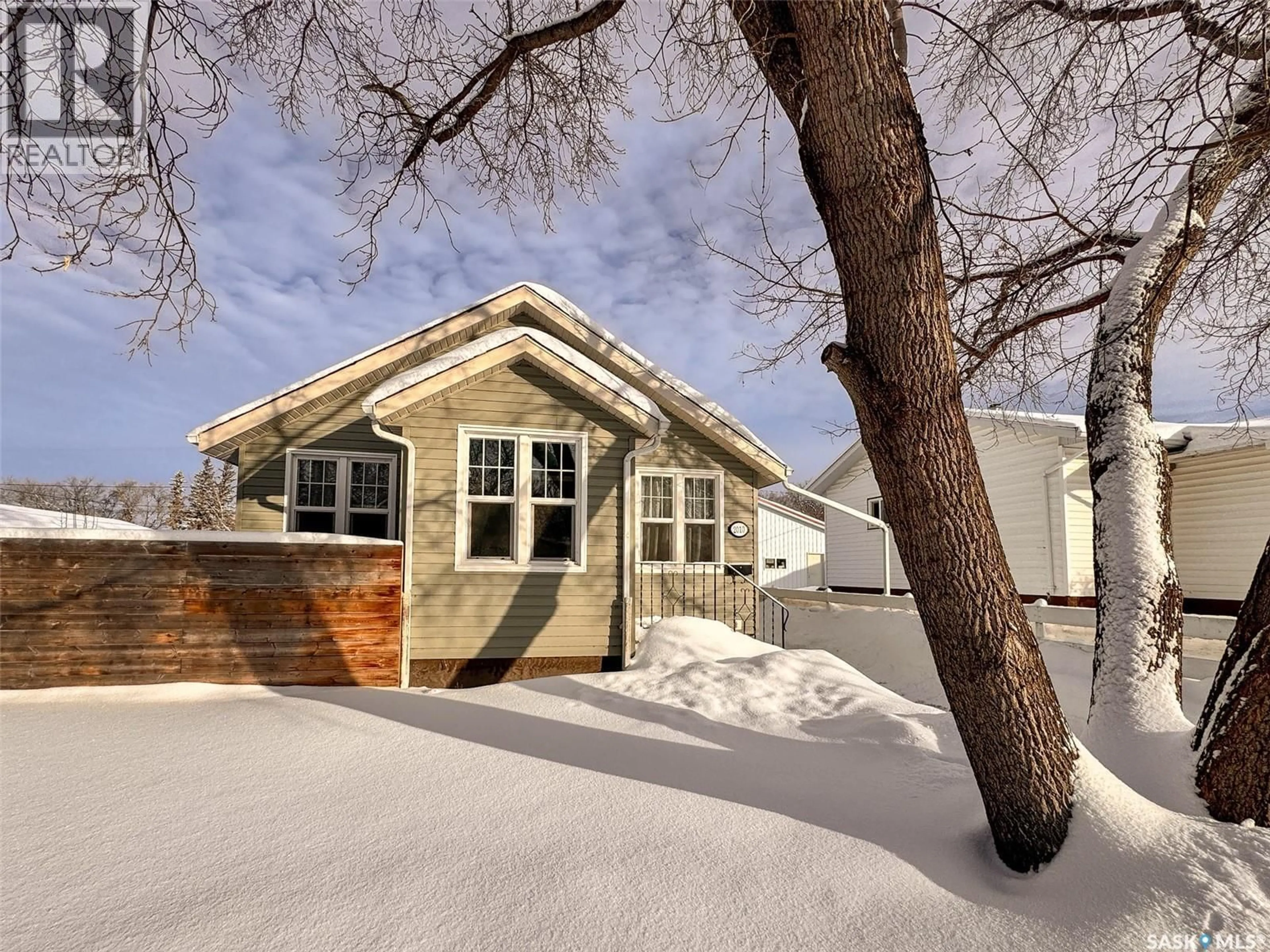 Home with brick exterior material, street for 2010 10TH STREET, Rosthern Saskatchewan S0K3R0