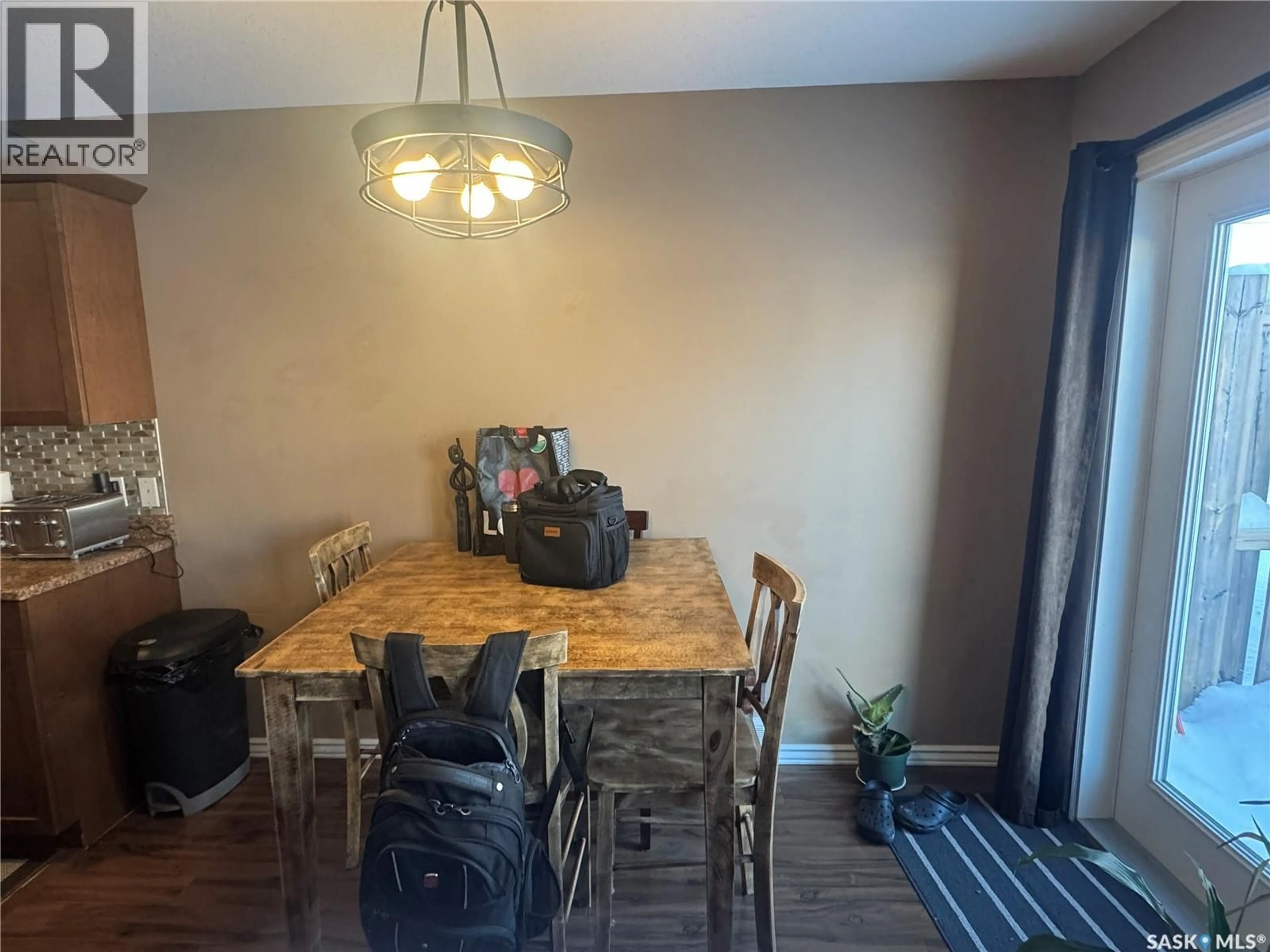 Dining room, wood/laminate floor for 3 - 360 STUDER STREET, La Ronge Saskatchewan S0J1L0