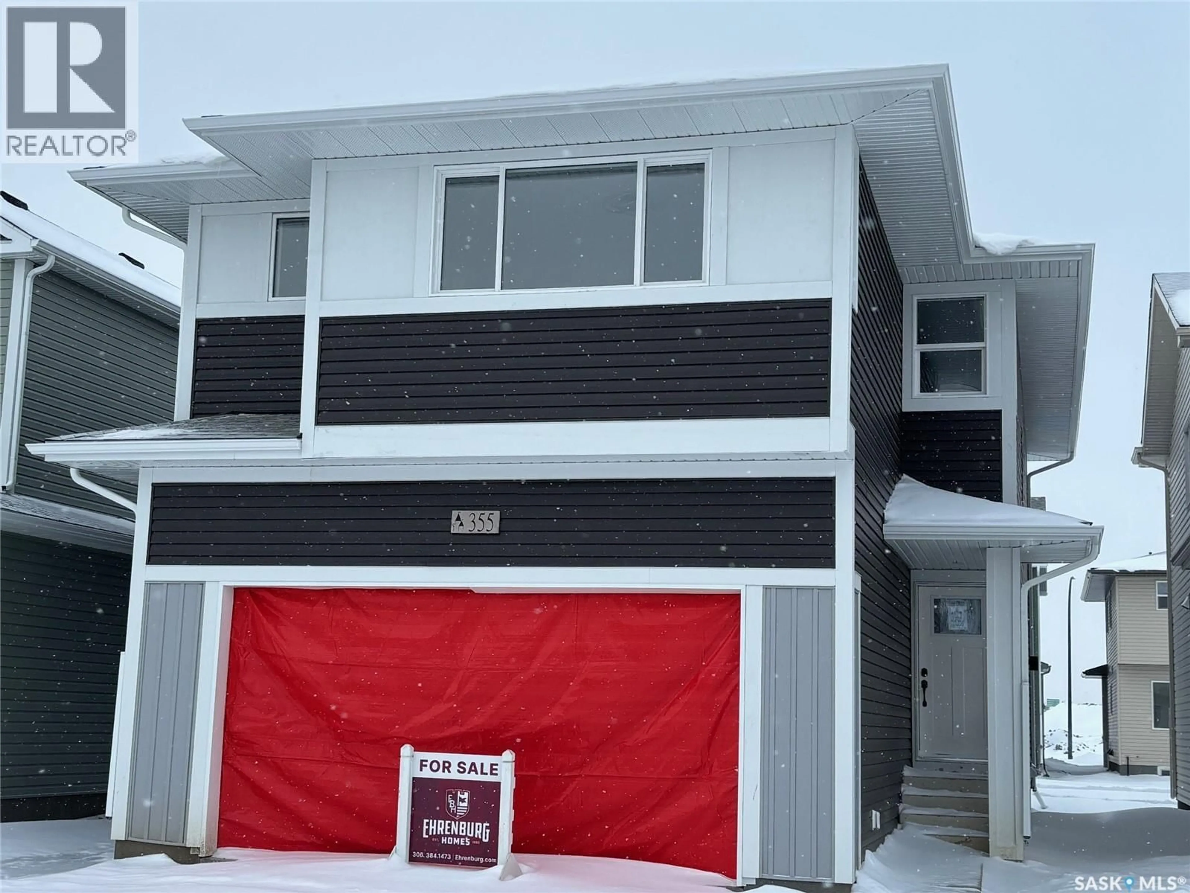 Home with vinyl exterior material, street for 355 ASOKAN BEND, Saskatoon Saskatchewan S7V1V8