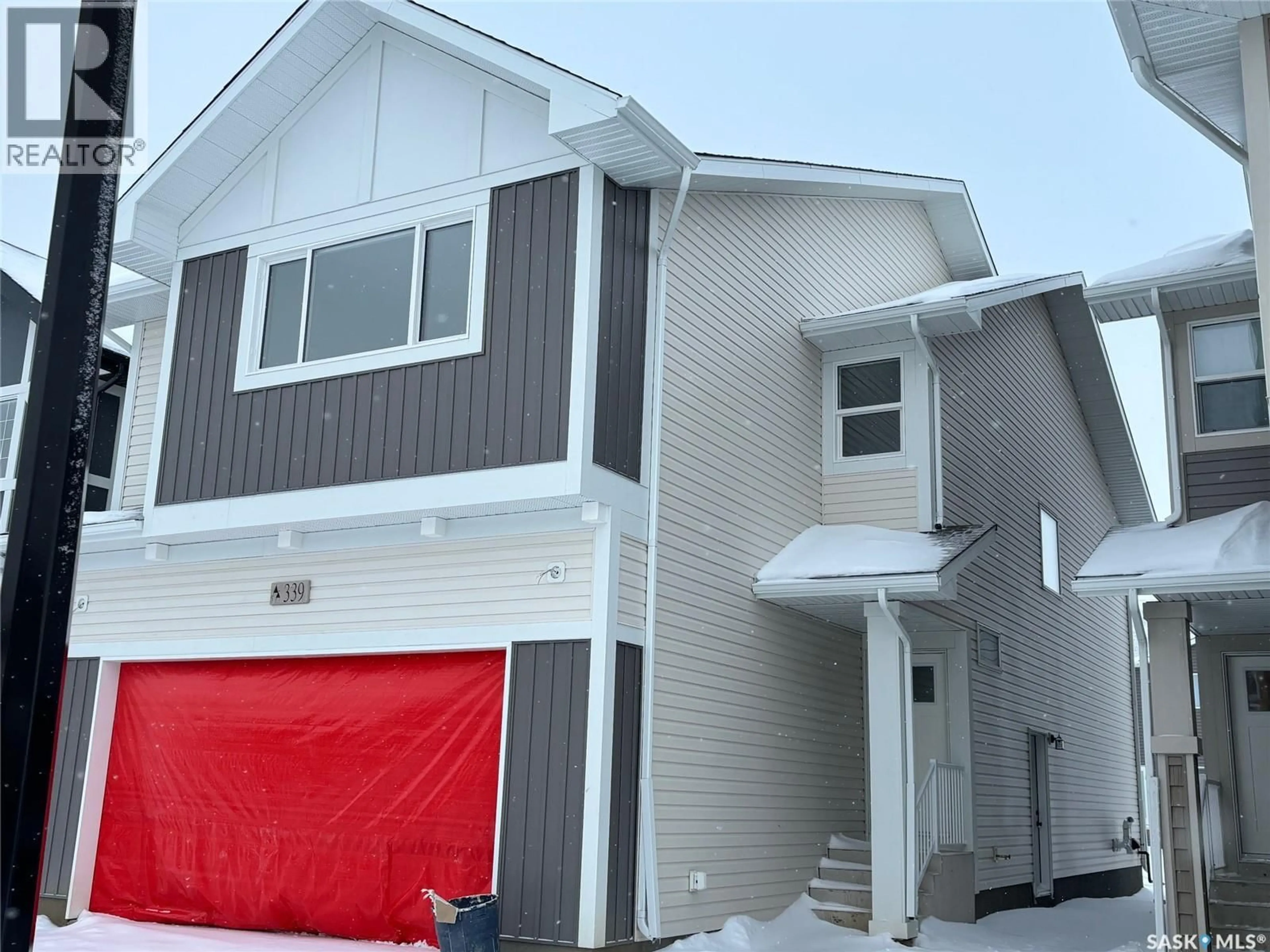 Home with vinyl exterior material, street for 339 ASOKAN BEND, Saskatoon Saskatchewan S7V1V8
