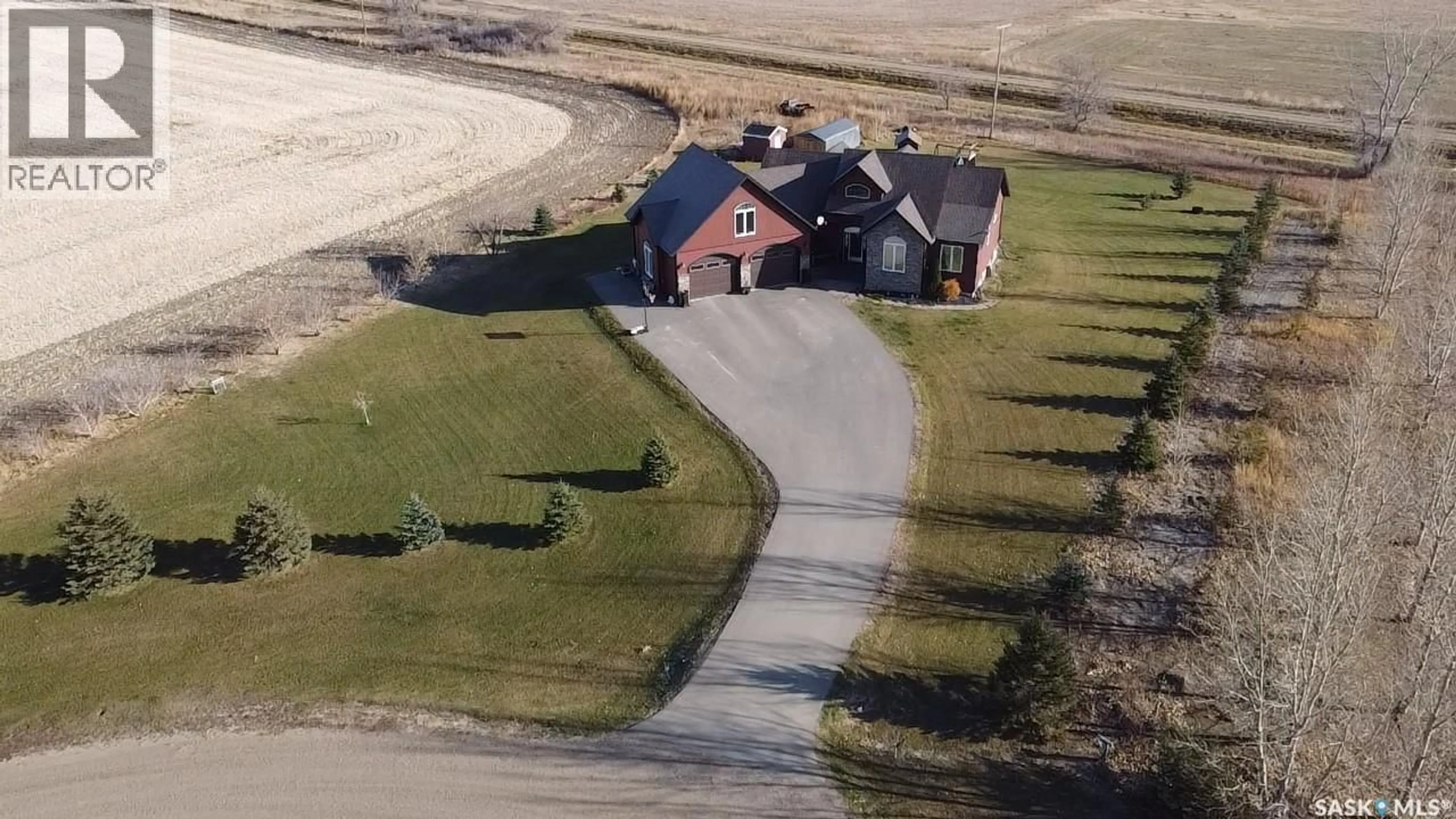 A pic from outside/outdoor area/front of a property/back of a property/a pic from drone, street for 219 CARRIAGE DRIVE, Rudy Rm No. 284 Saskatchewan S0L2N0