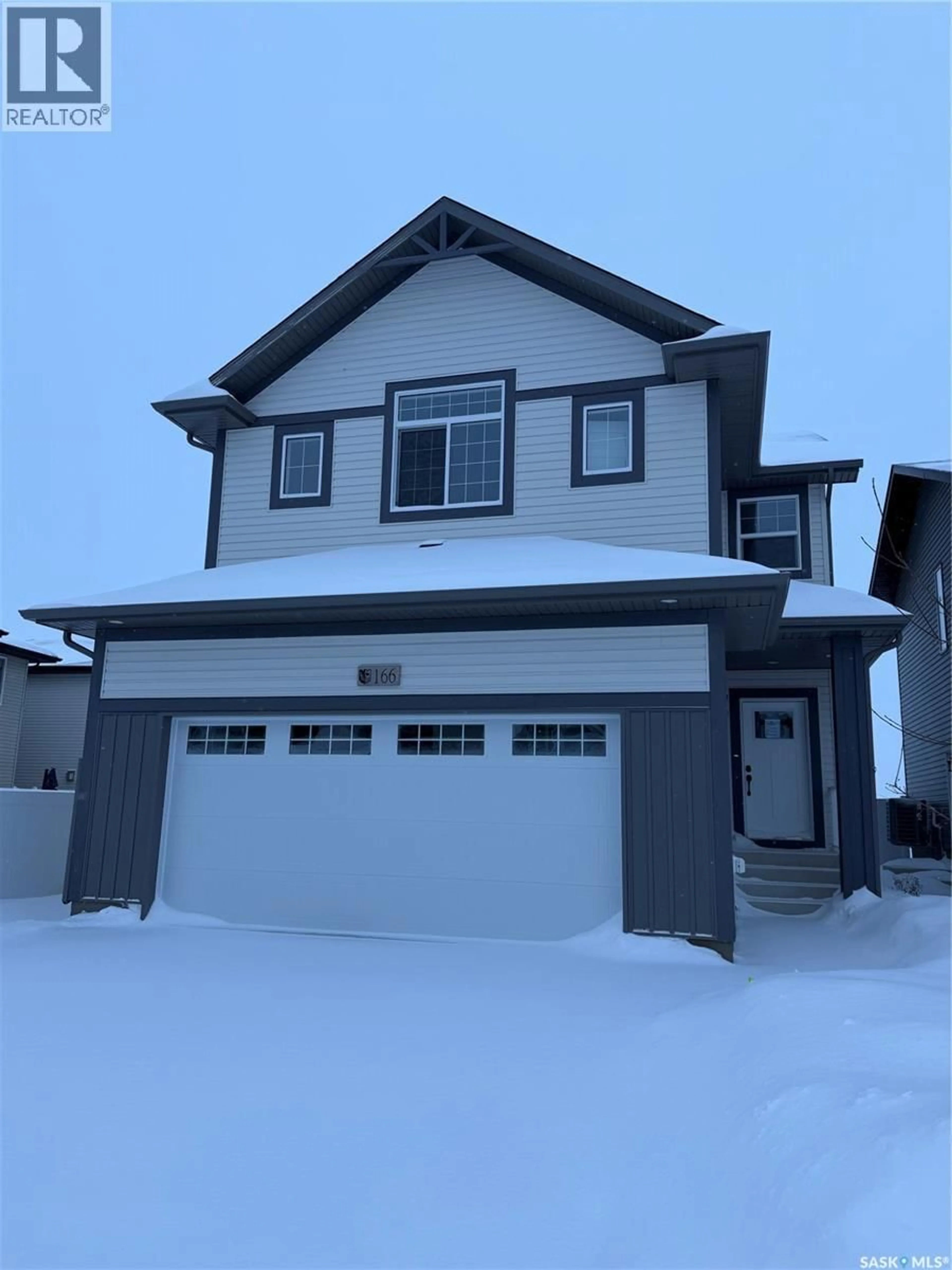 Home with vinyl exterior material, street for 166 DORAN WAY, Saskatoon Saskatchewan S7V0Z7
