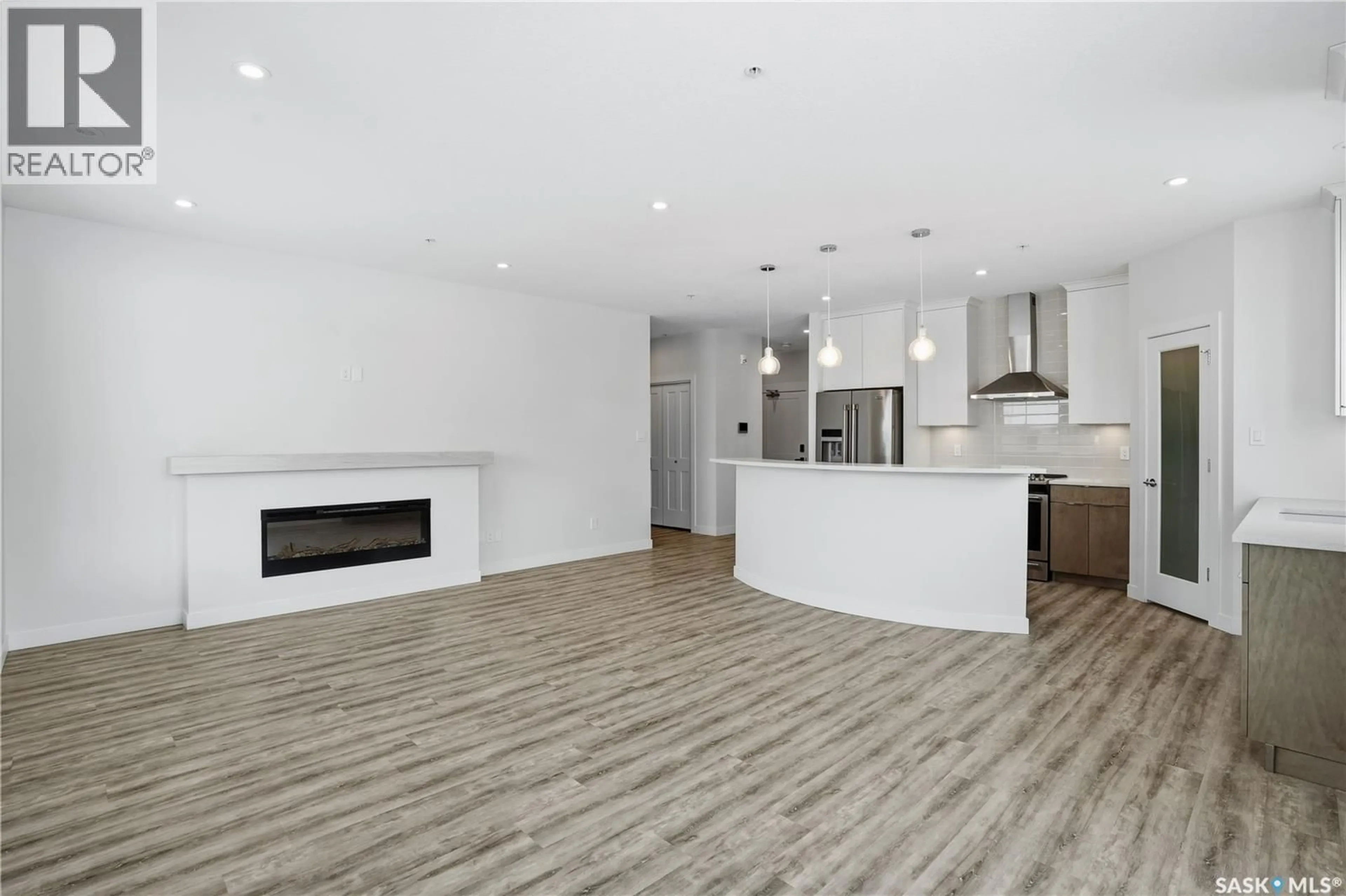 Open concept kitchen, wood/laminate floor for 3581 - 201 EVANS COURT, Regina Saskatchewan S4S7A3