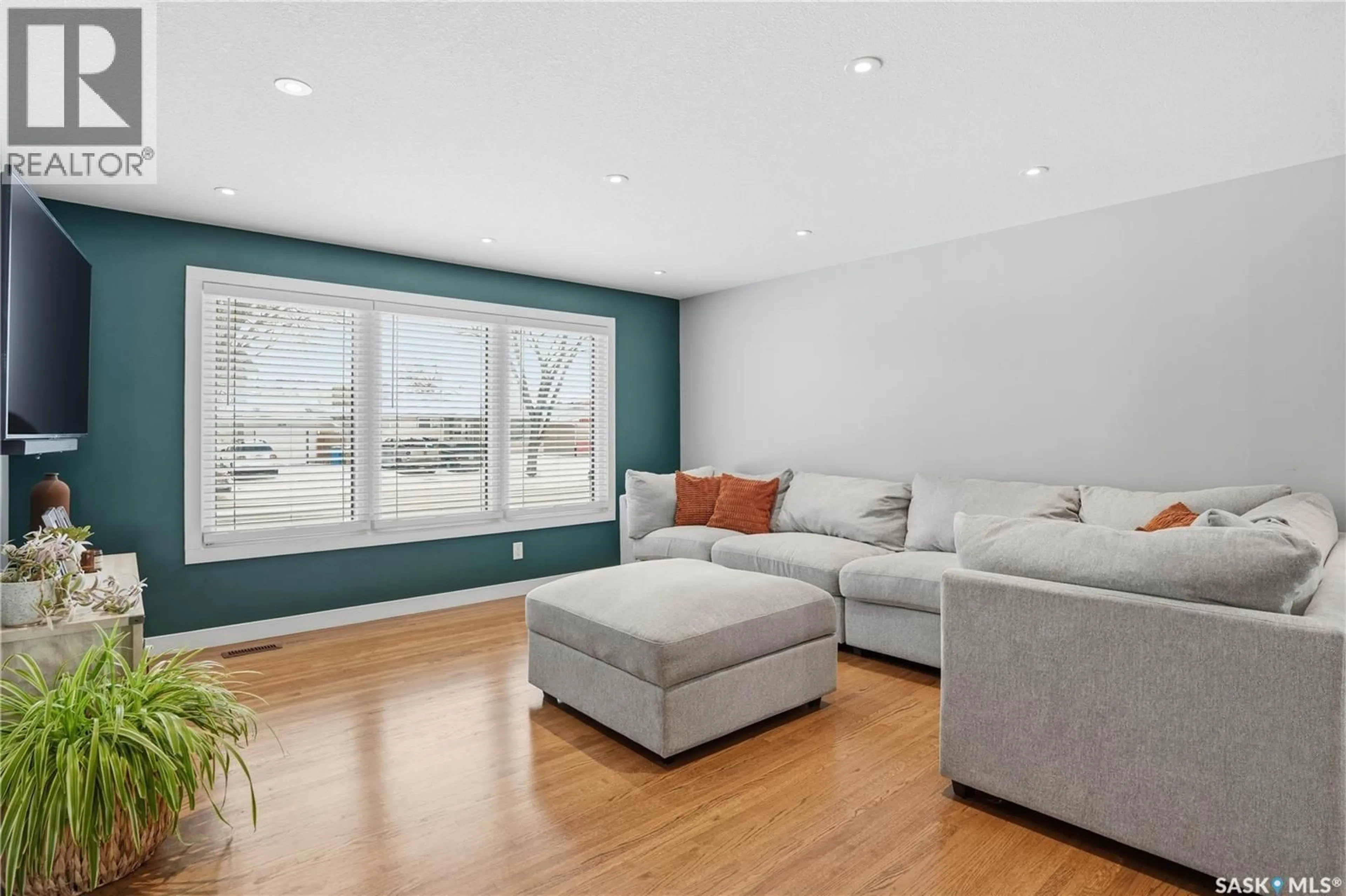 Living room with furniture, wood/laminate floor for 3029 6TH AVENUE, Regina Saskatchewan S4R0P3