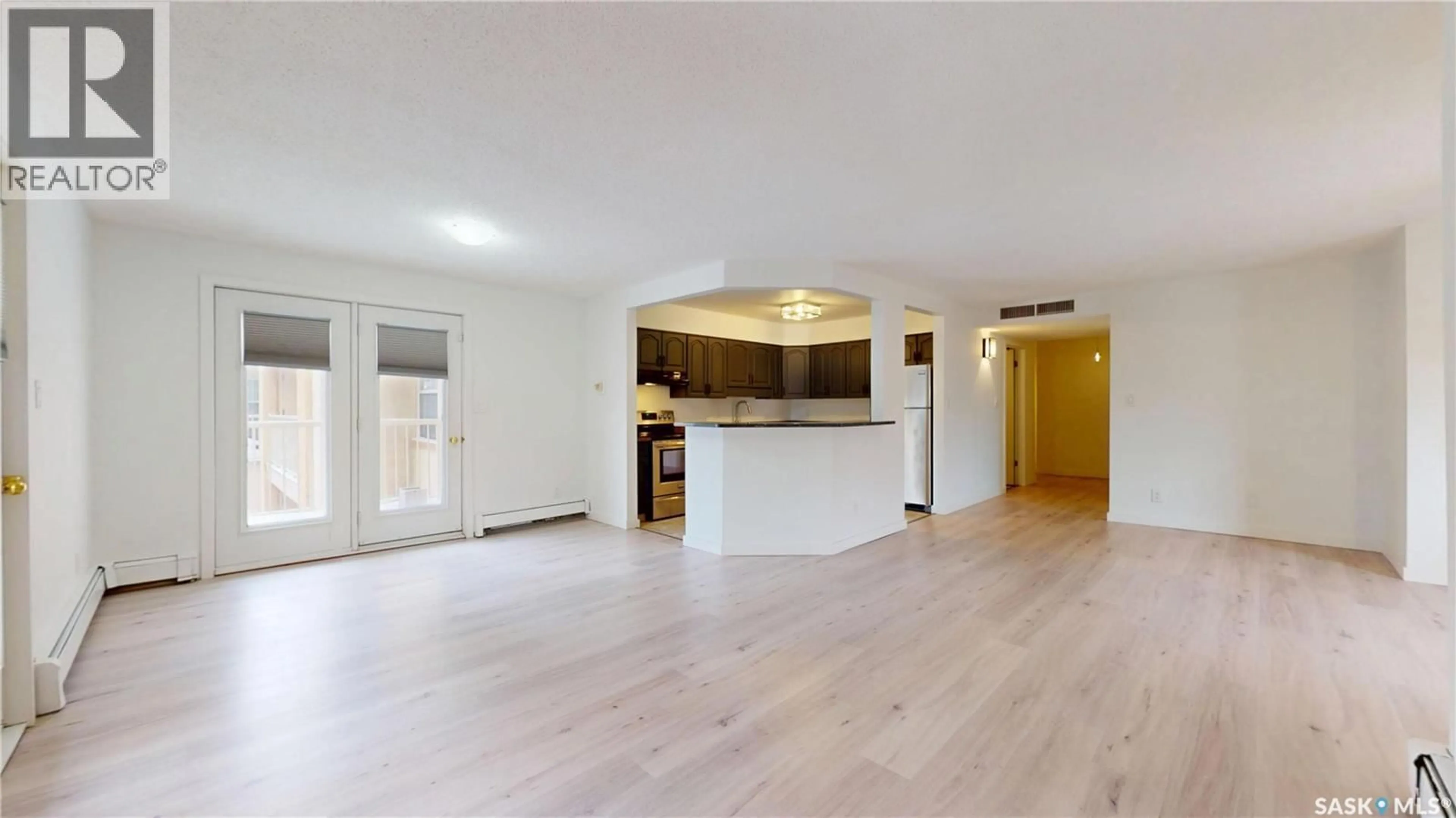 Open concept kitchen, wood/laminate floor for 304 - 2315 CORNWALL STREET, Regina Saskatchewan S4P2L4