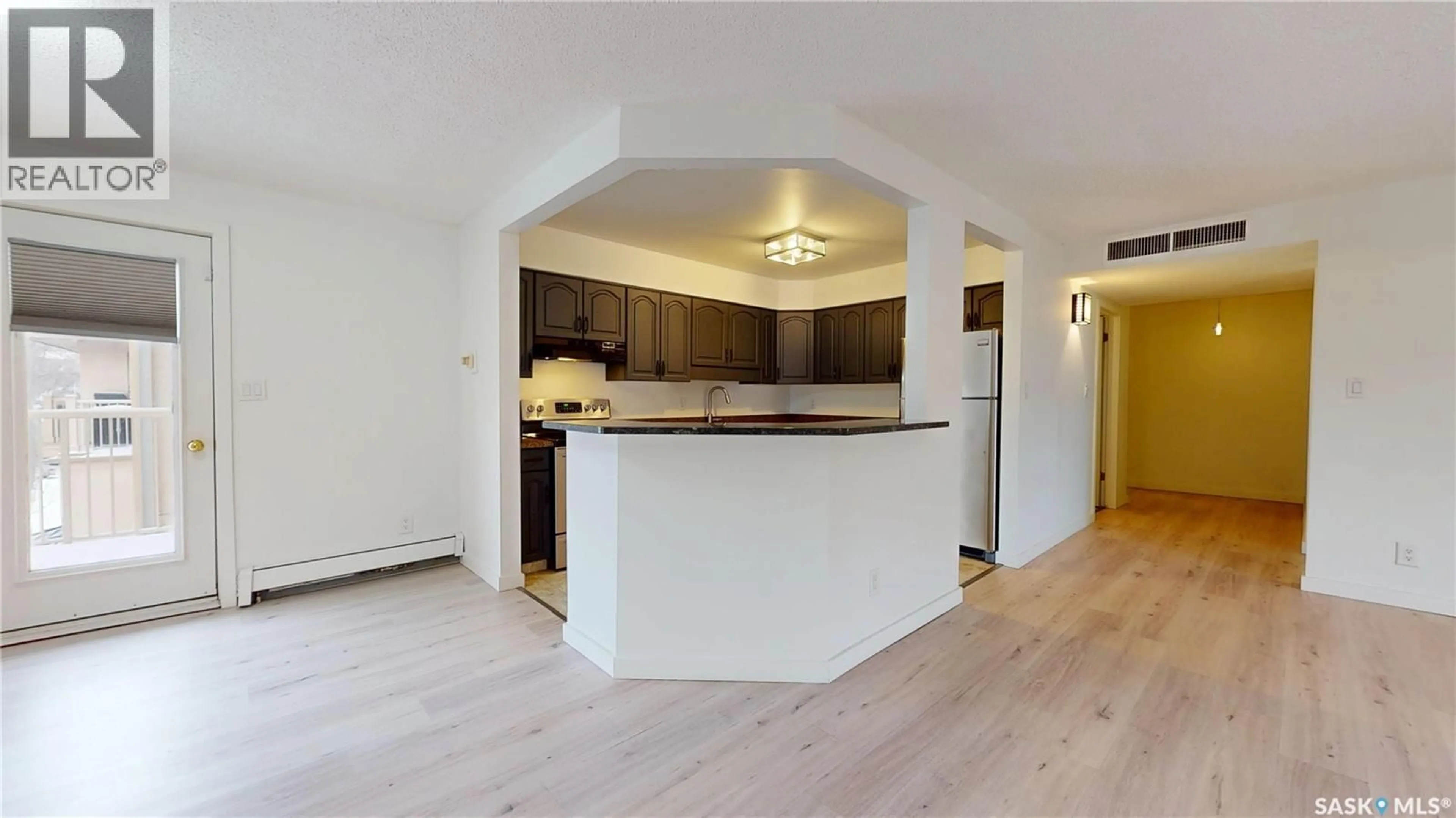 Open concept kitchen, wood/laminate floor for 304 - 2315 CORNWALL STREET, Regina Saskatchewan S4P2L4