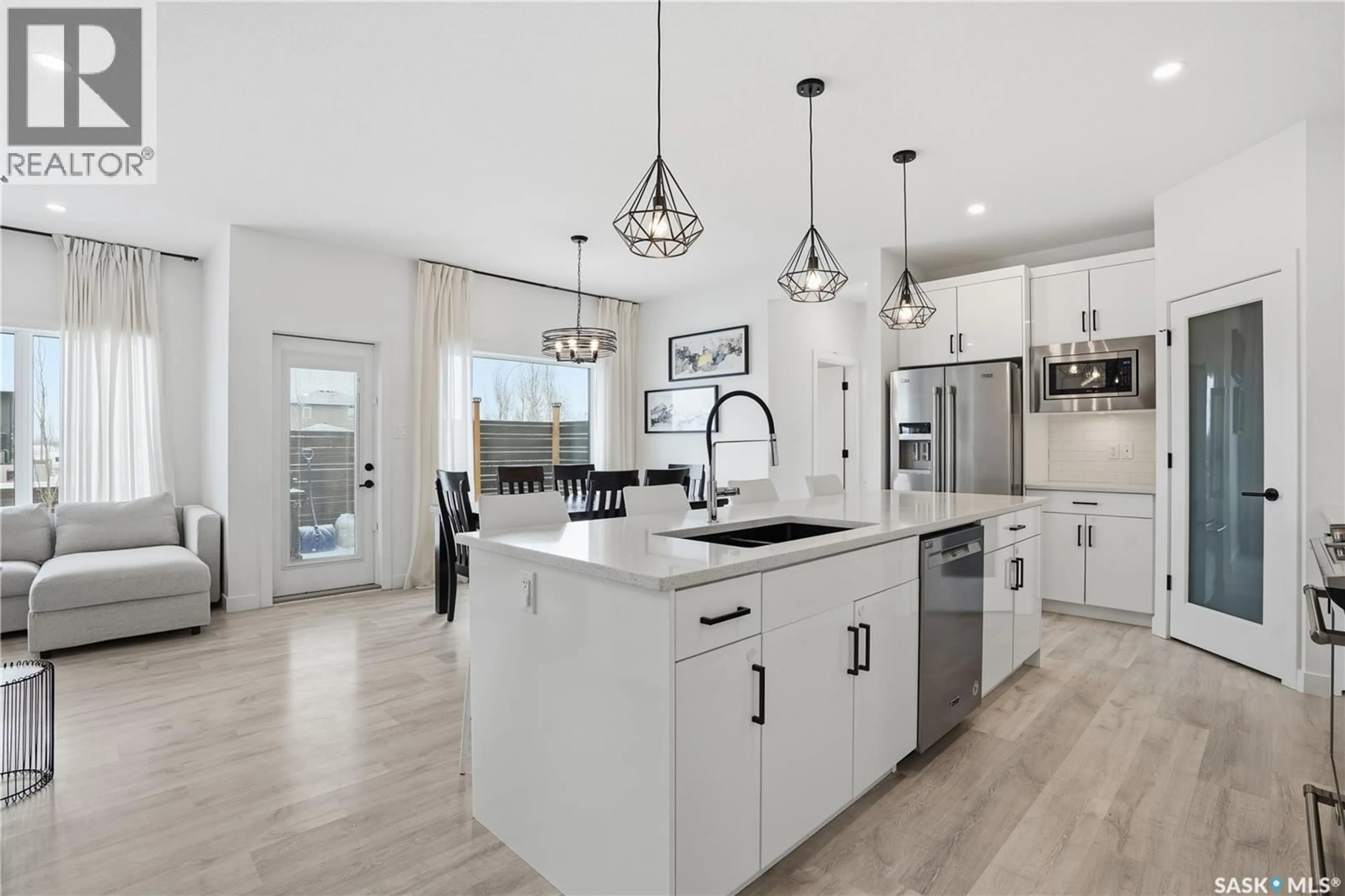 Open concept kitchen, ceramic/tile floor for 18 MACKENZIE CRESCENT, Pilot Butte Saskatchewan S0G3Z0