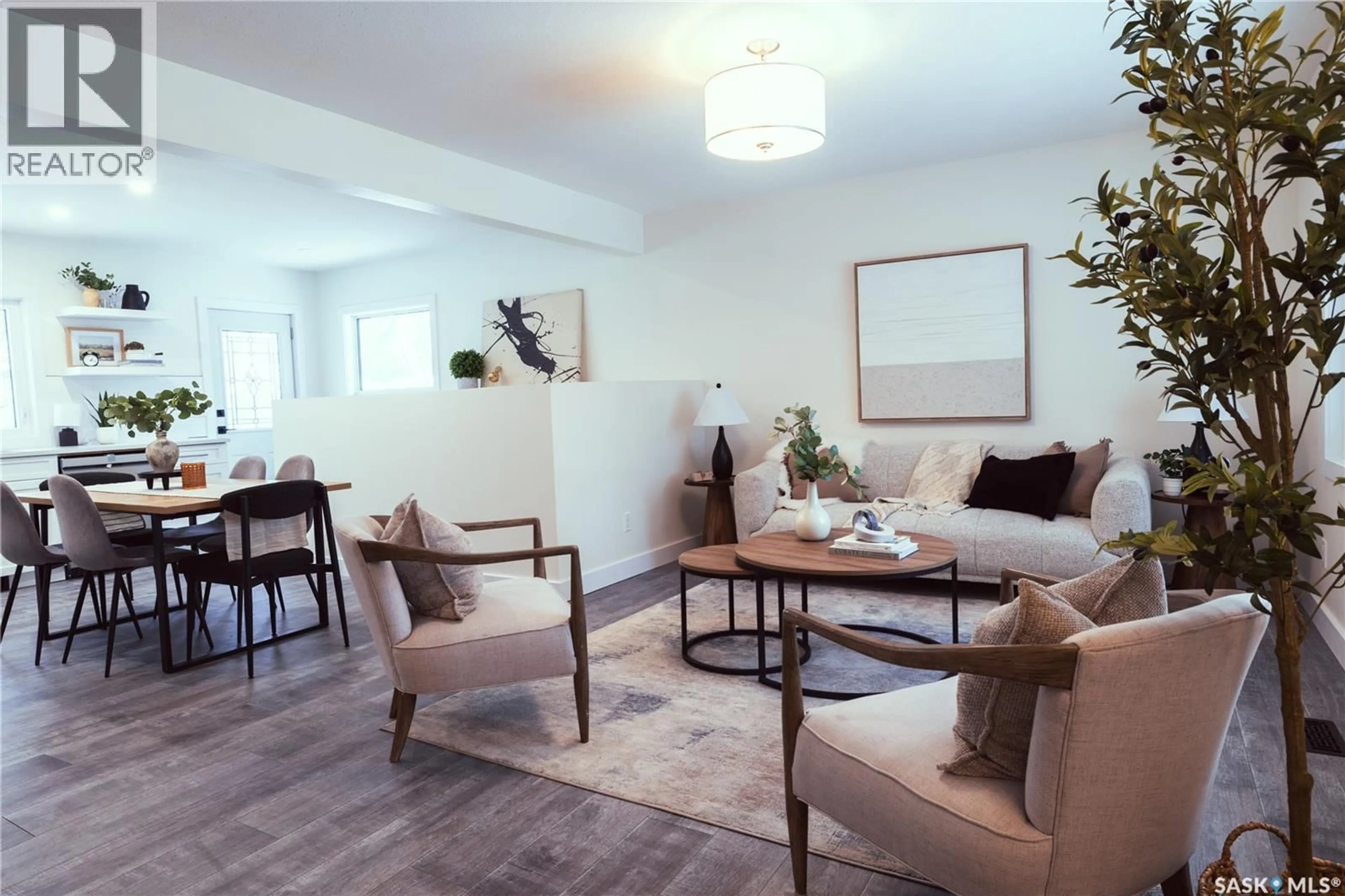 Living room with furniture, wood/laminate floor for 1379 MINTO STREET, Regina Saskatchewan S4T5J2