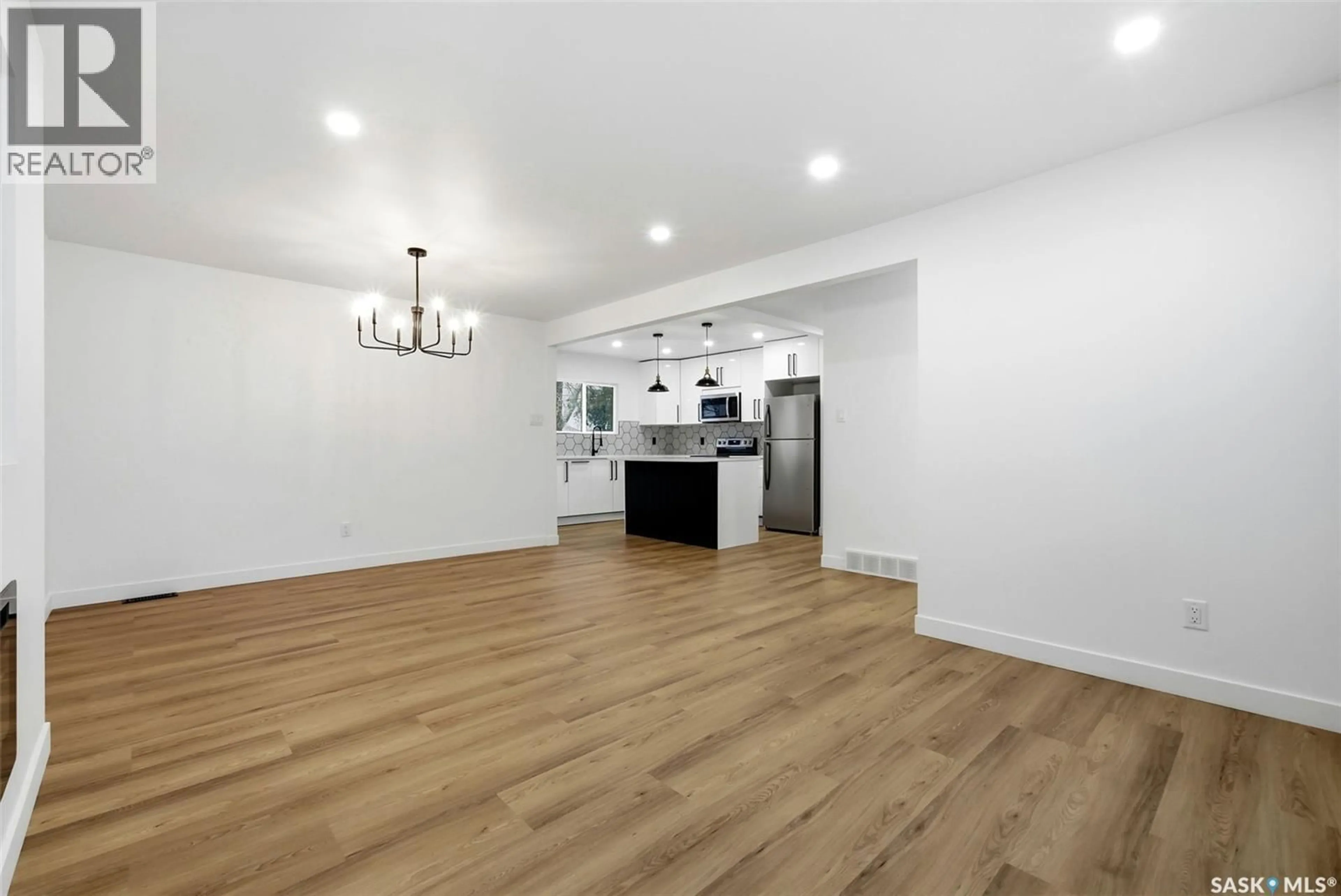 Open concept kitchen, wood/laminate floor for 732 EMPRESS STREET, Regina Saskatchewan S4T5C8