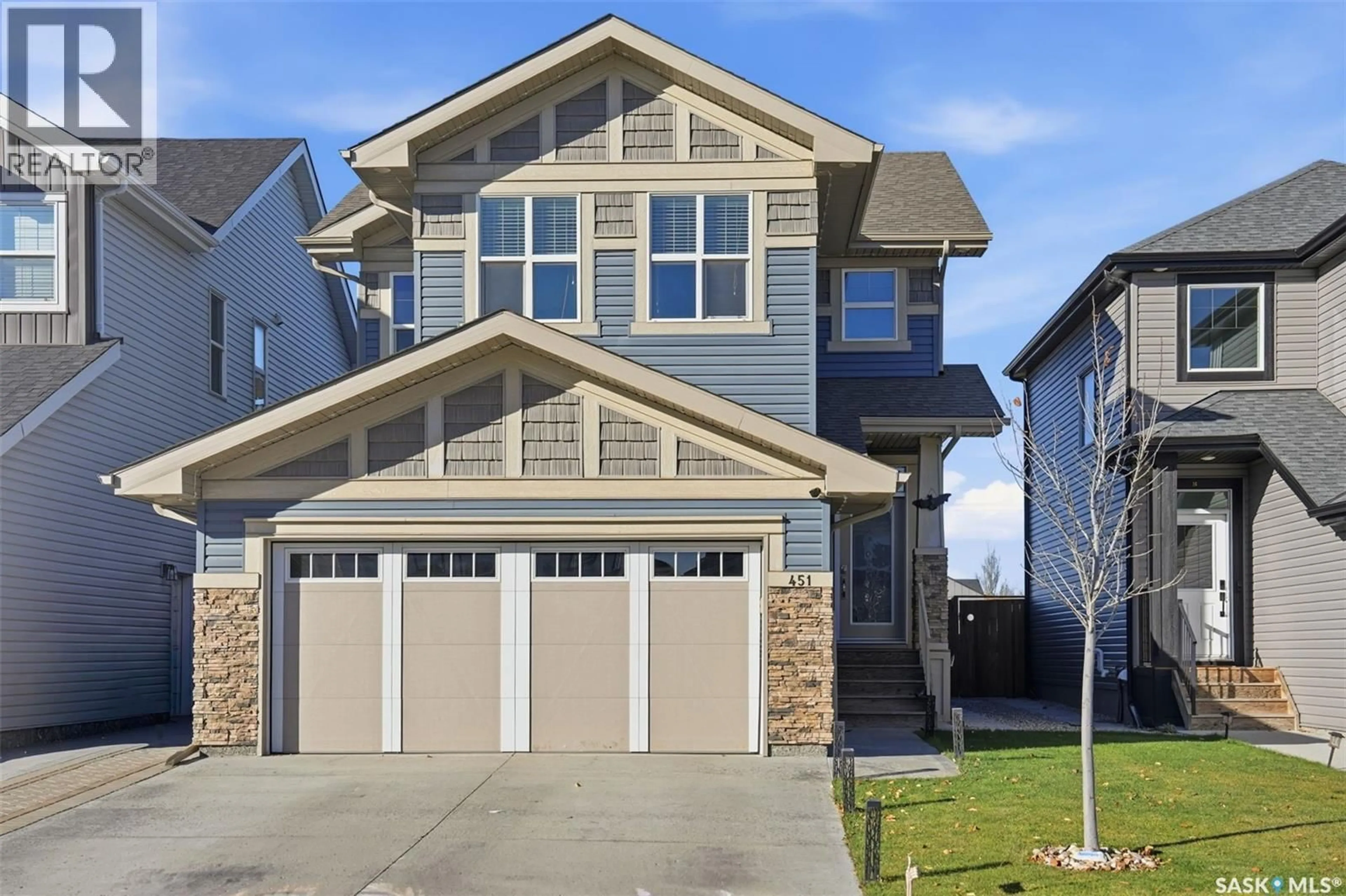 Home with vinyl exterior material, street for 451 MCFAULL CRESCENT, Saskatoon Saskatchewan S7V0T2