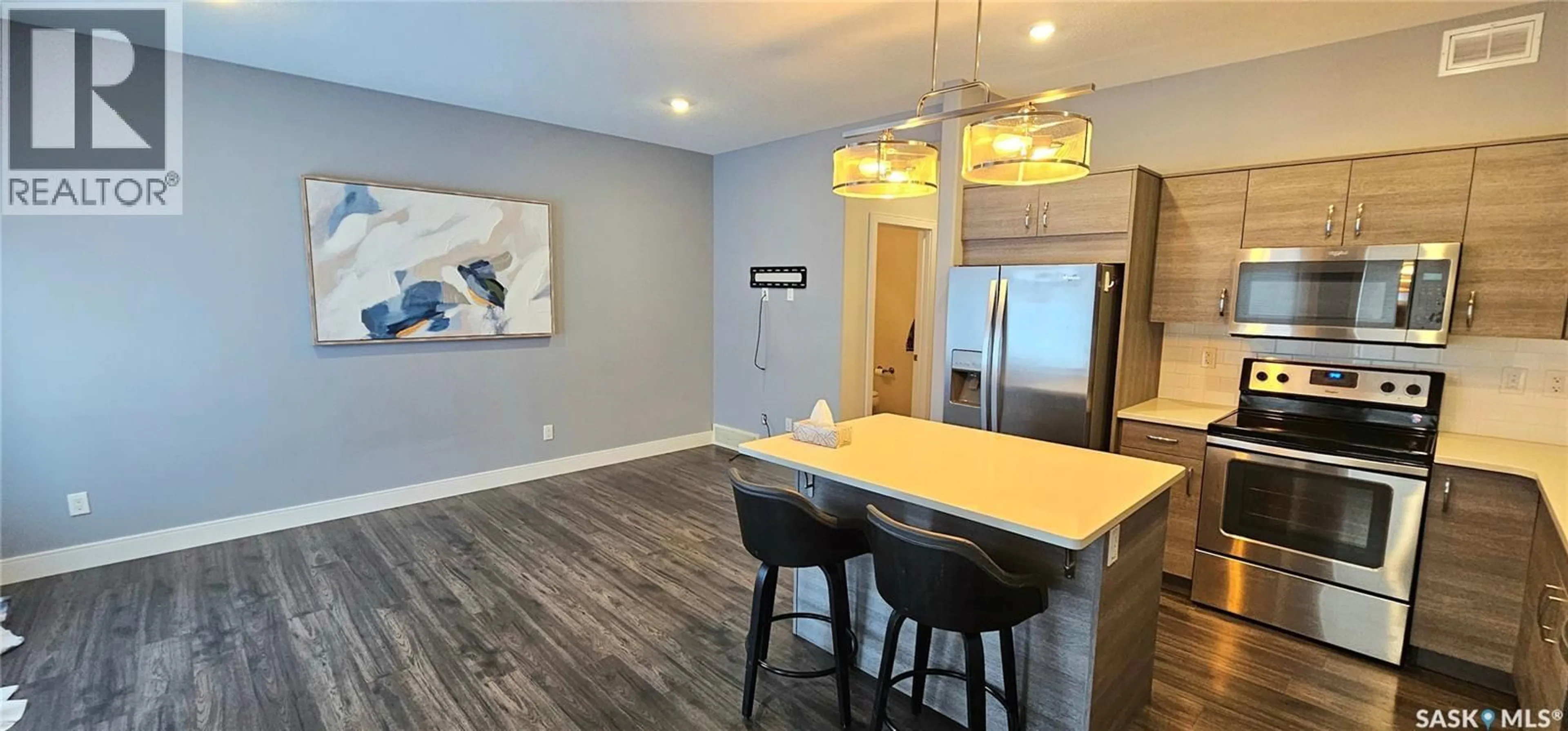 Open concept kitchen, wood/laminate floor for 51 115 VELTKAMP CRESCENT, Saskatoon Saskatchewan S7T0T7