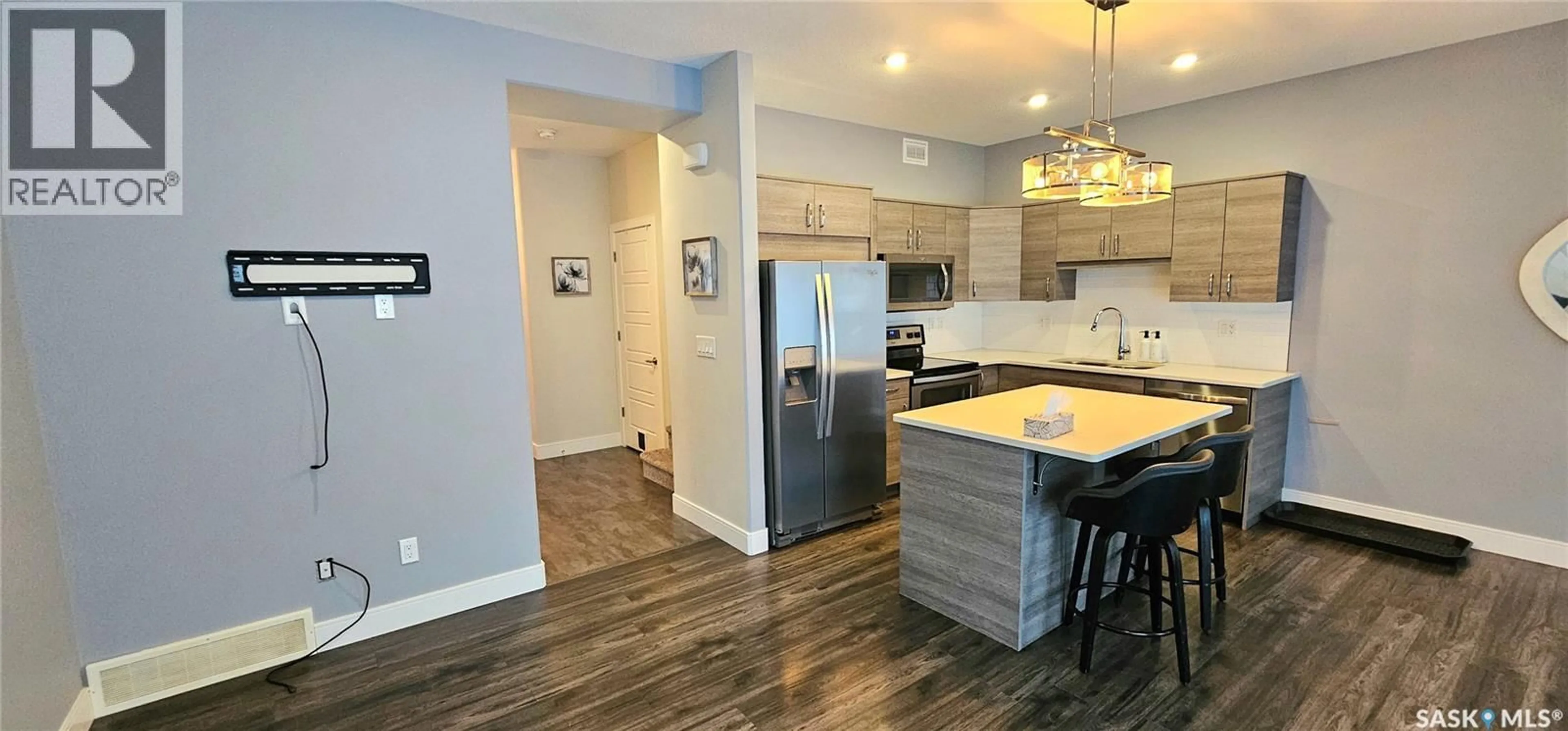 Open concept kitchen, wood/laminate floor for 51 115 VELTKAMP CRESCENT, Saskatoon Saskatchewan S7T0T7